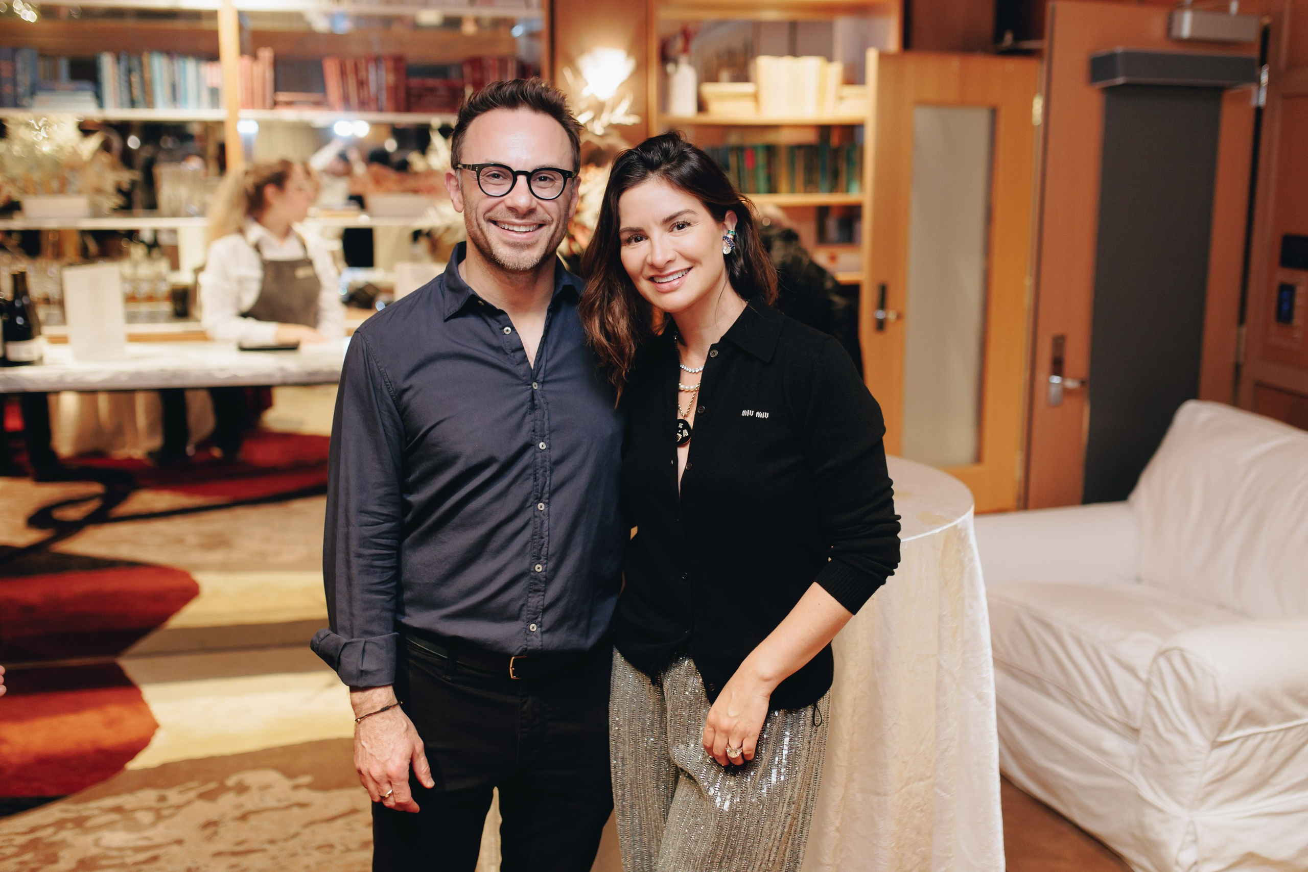 Smiling couple at home party, casual event