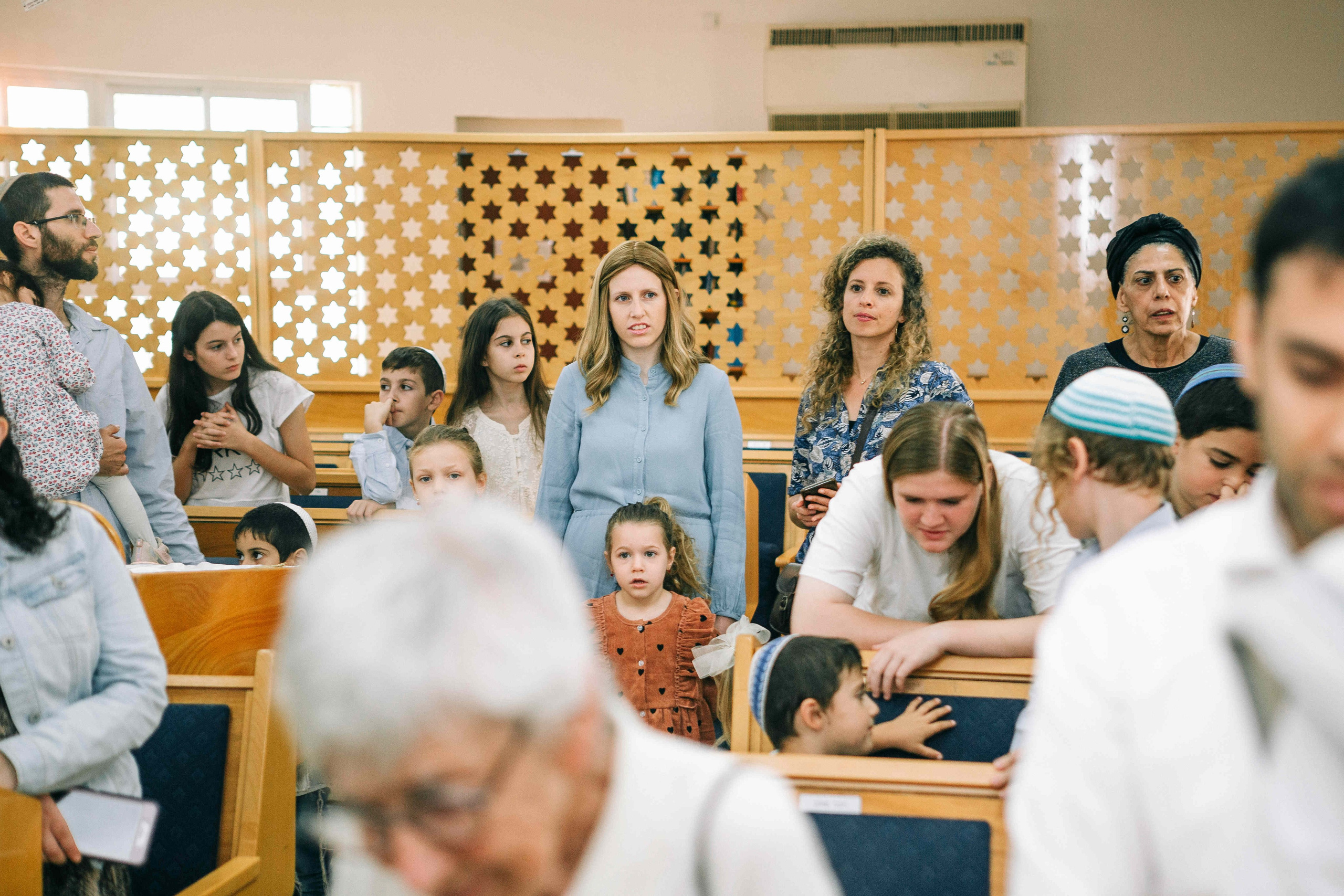 BRITH MILA IN THE SMALL SYNAGOGUE. PHOTOGRAPHER IN ISRAEL
