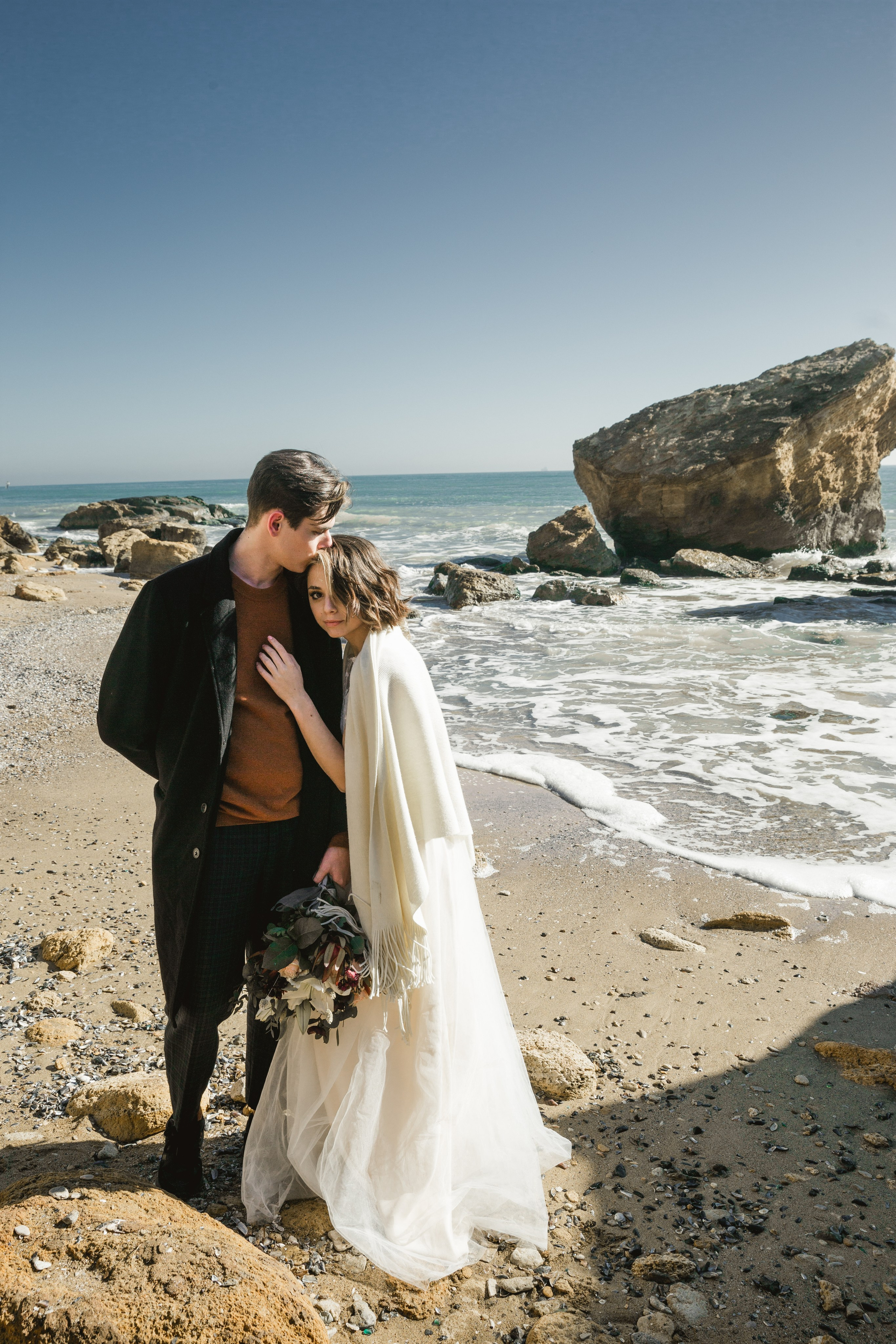 Seaside love story photoshoot at golden sunset, wedding photography France