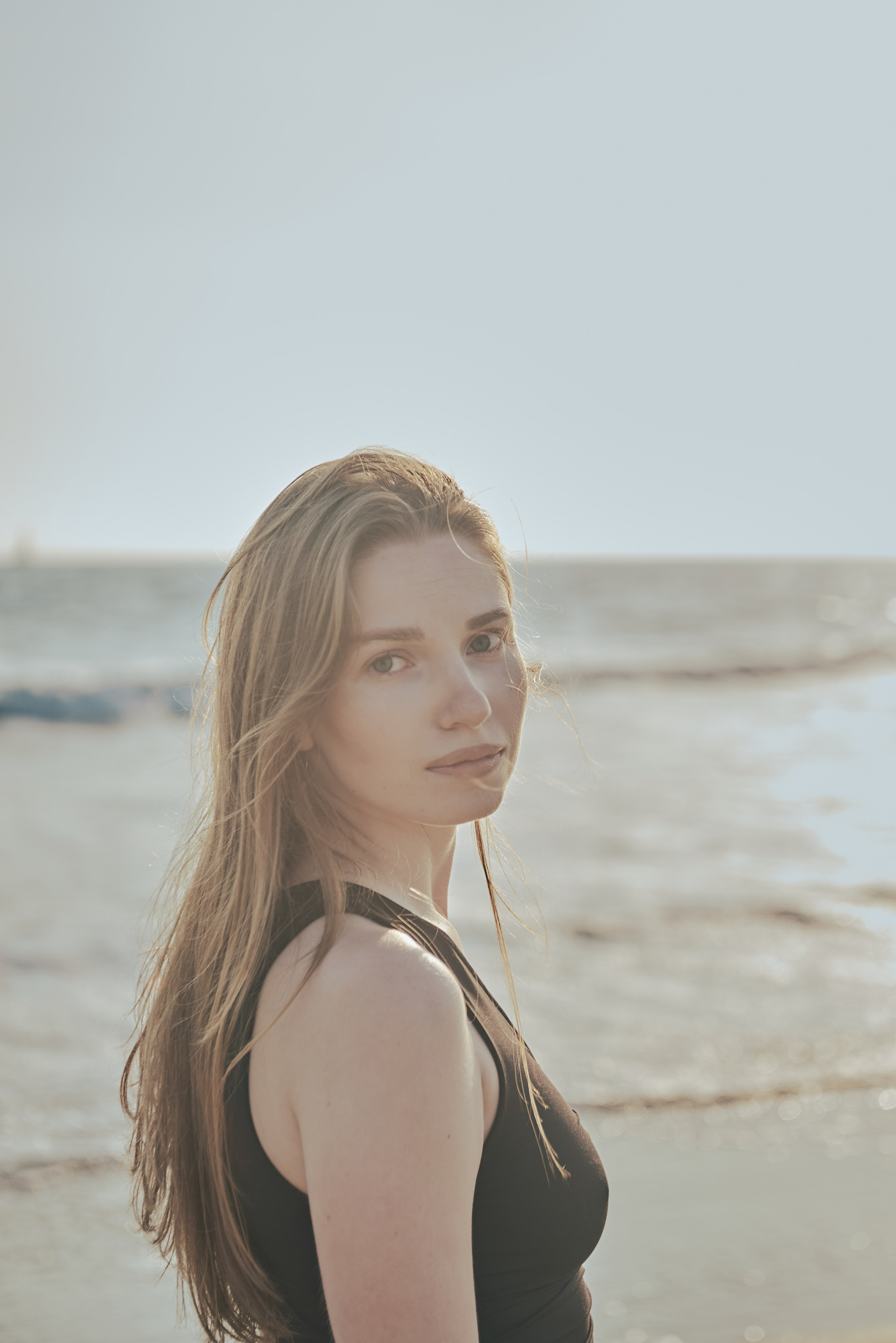 Golden hour at the beach: girl walking along Santa Monica Beach