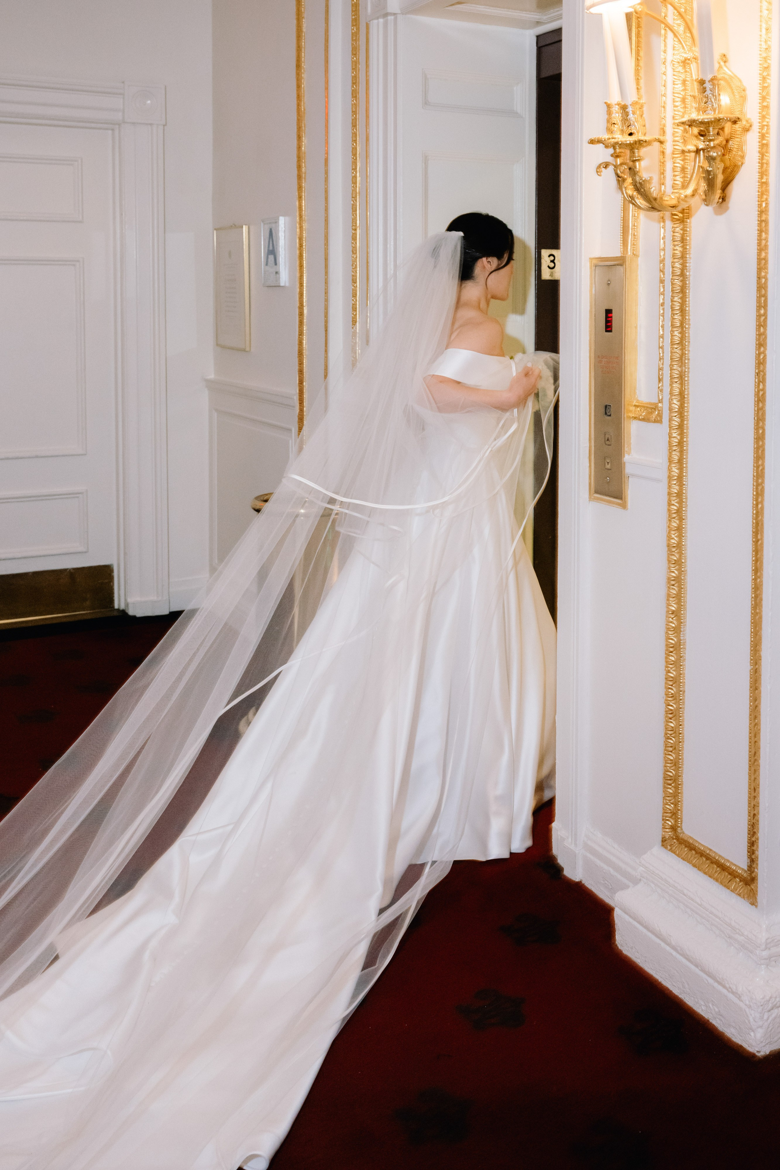 a bride in a wedding dress is standing in a doorway