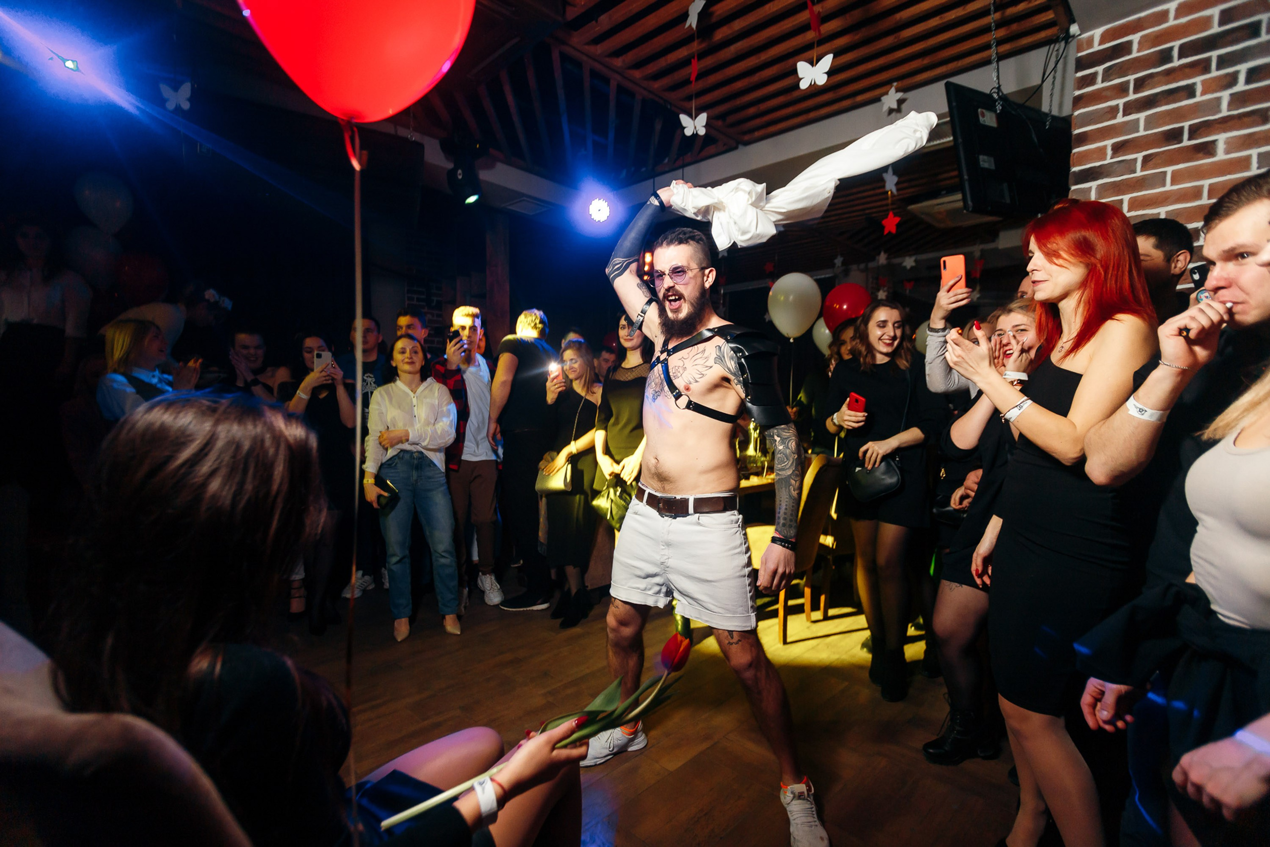 Party scene with balloons and people dancing