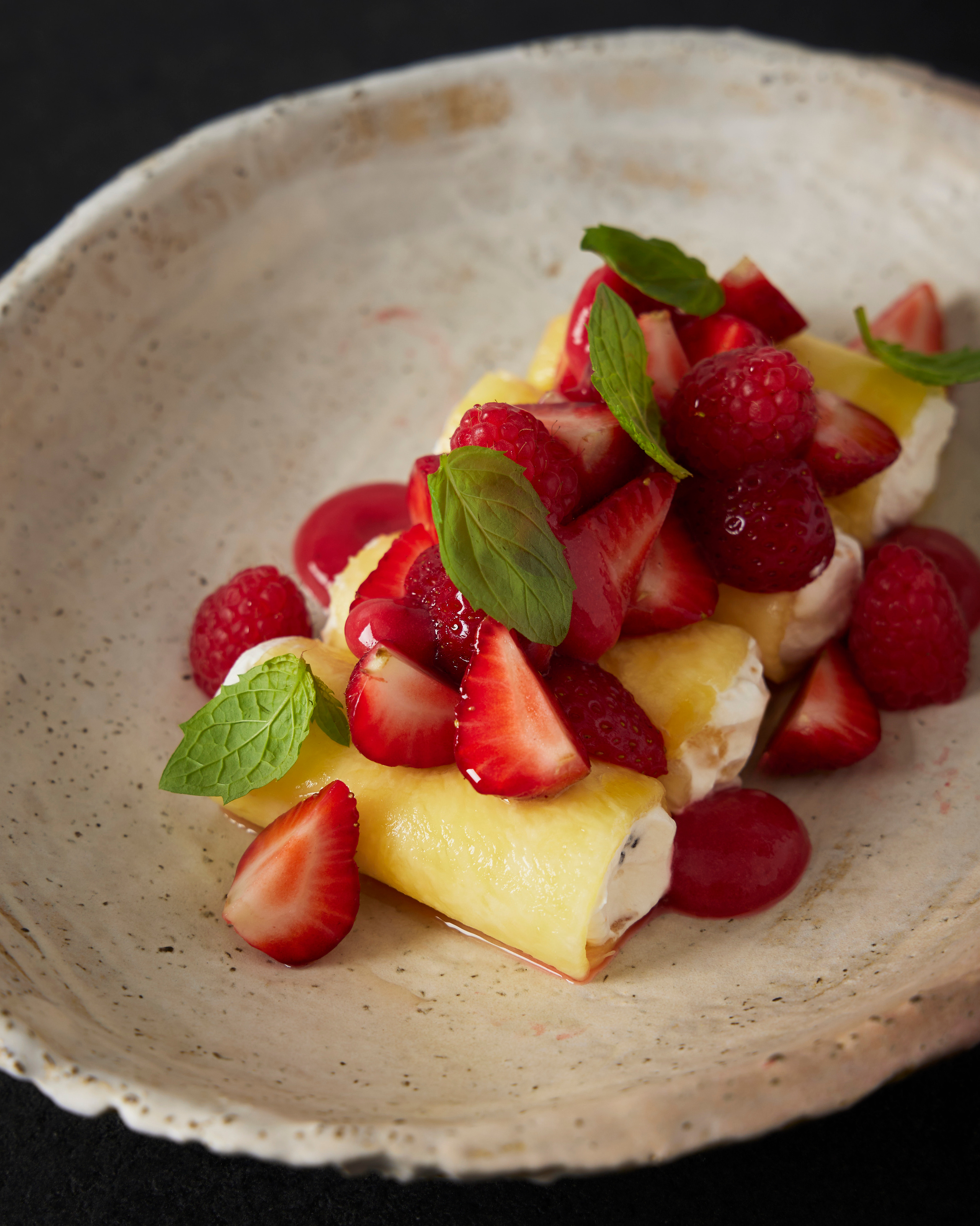 summer dessert with pineapple, fruits and berries