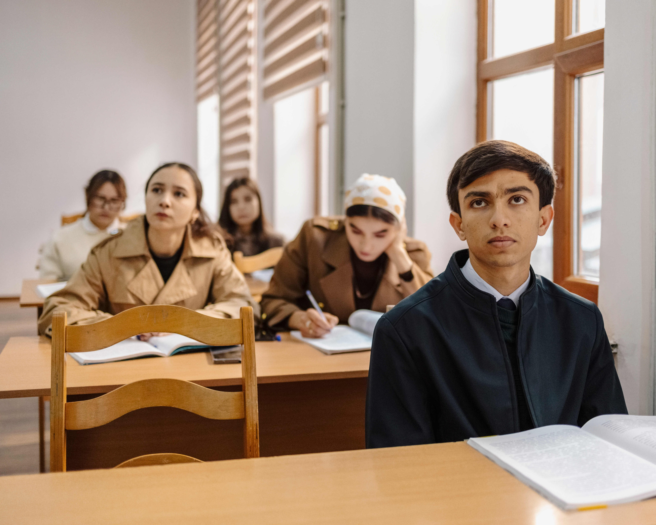 Students attend a Russian language class at Russian-Tajik Slavonic University in Dushanbe, Tajikistan. Russian remains compulsory in schools, typically starting from the second grade. Many parents prefer Russian-language schools, which are widely seen as offering better education and producing more competitive graduates.
