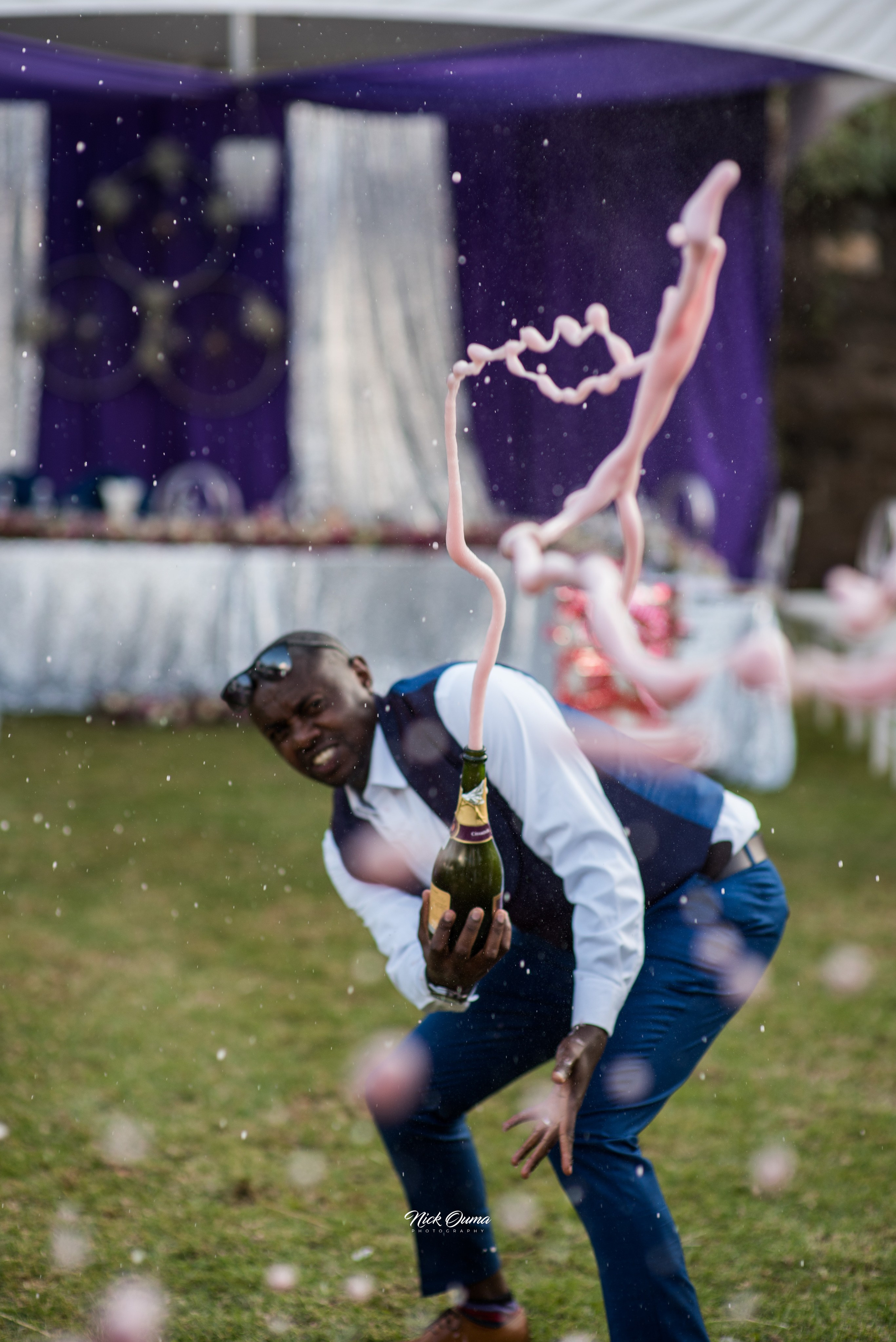 A photo of spilled champagne popped by the groomsman, at a wedding reception in Nairobi