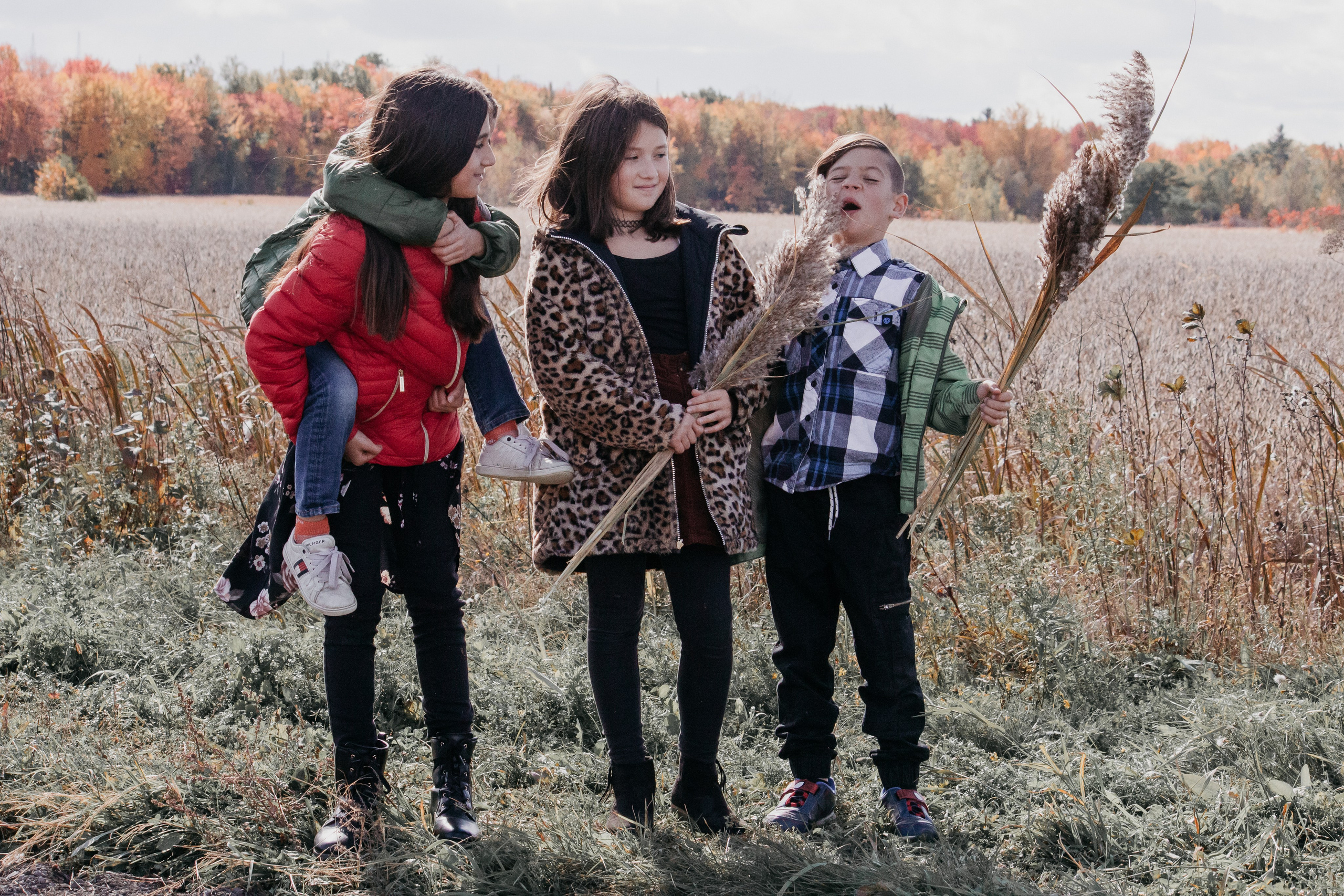 Candid family moments during an autumn photography session in Calgary