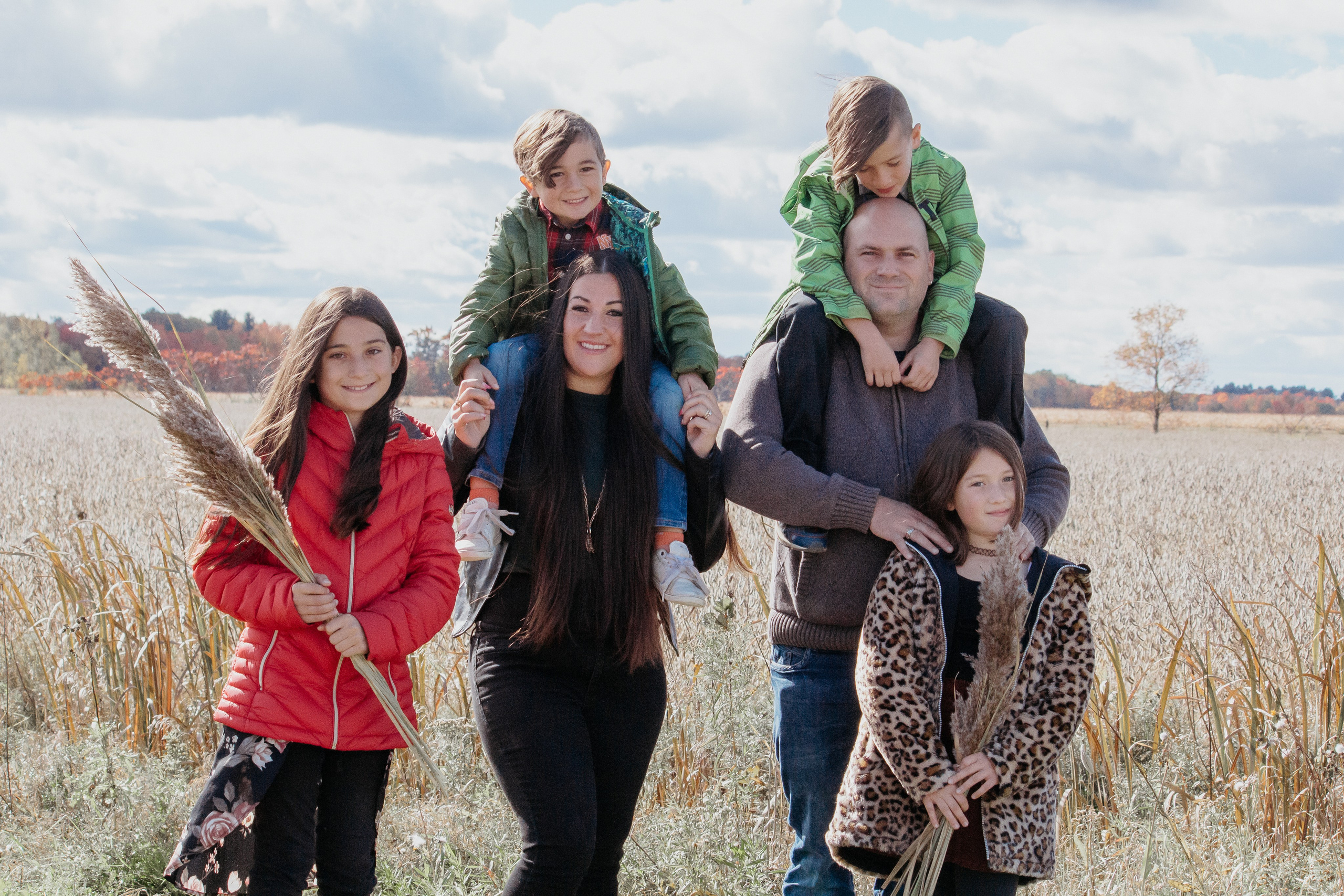 Family having fun together during a fall photoshoot in Calgary Alberta