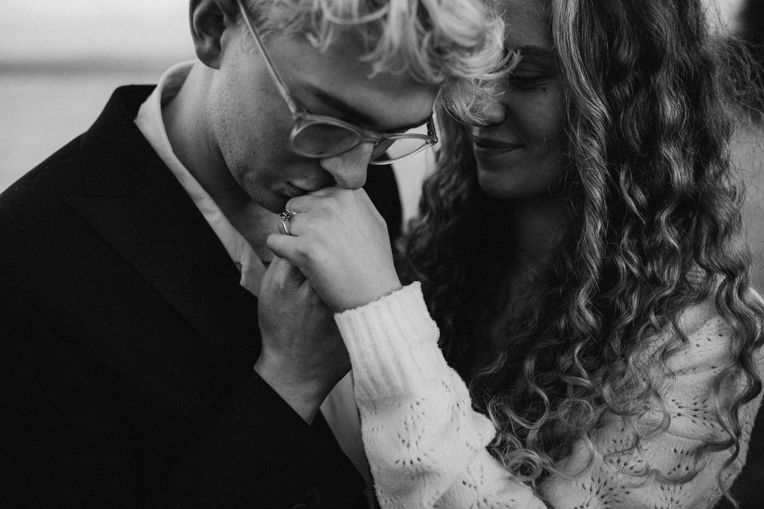 groom kiss bride's hand