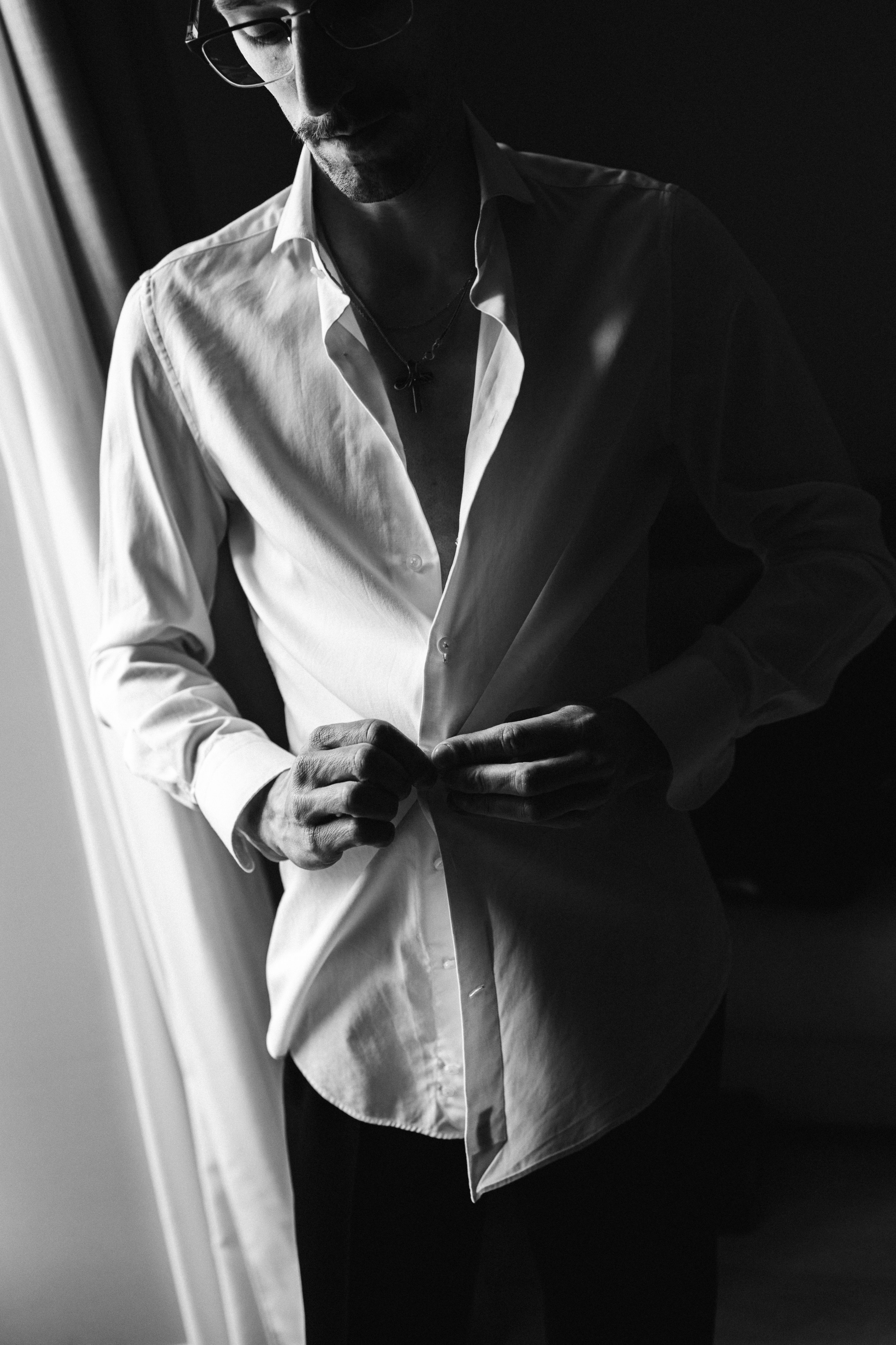 Black and white portraits and wedding details during groom preparations for a Lake Como wedding