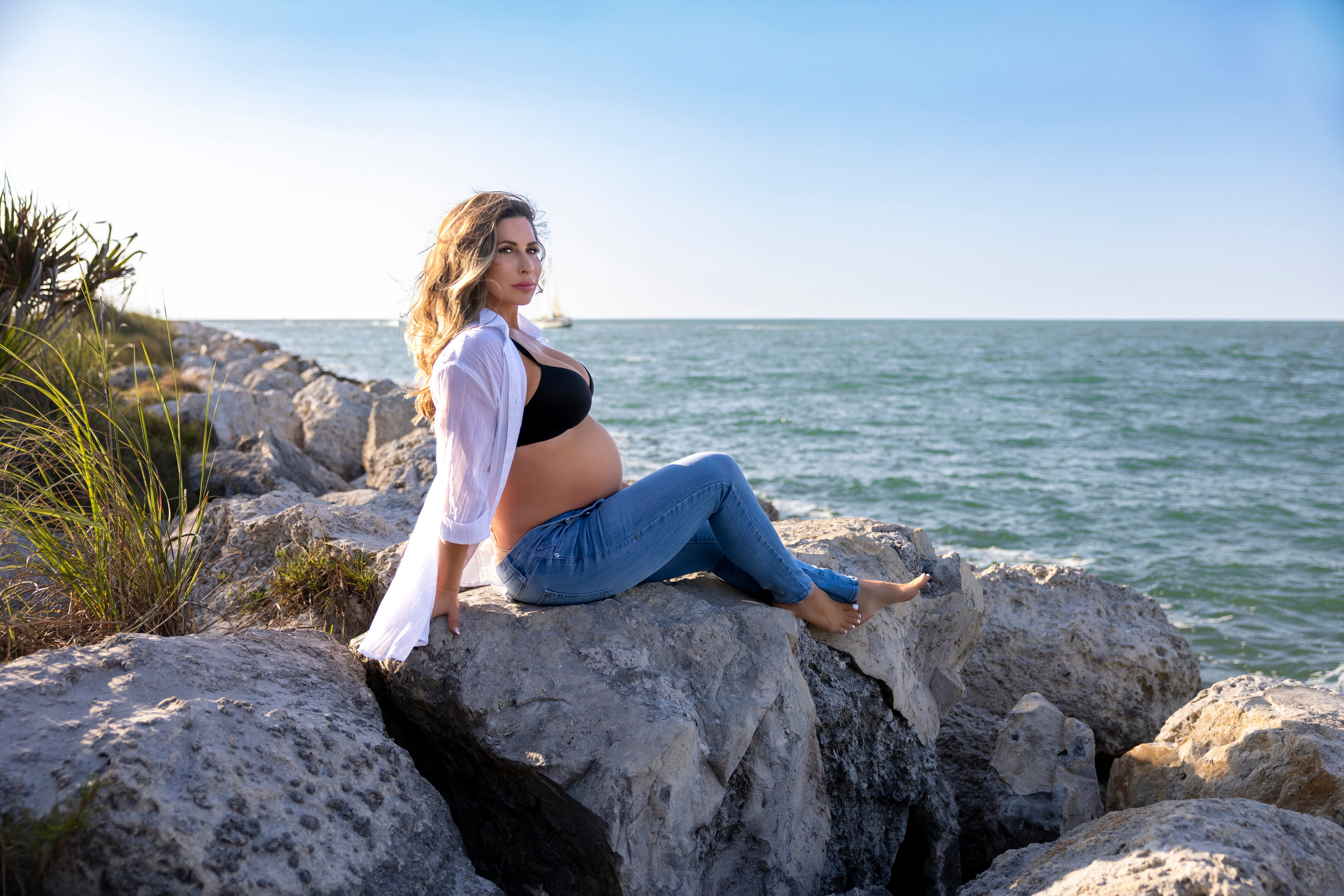 ocean and rocks pregnant wooman