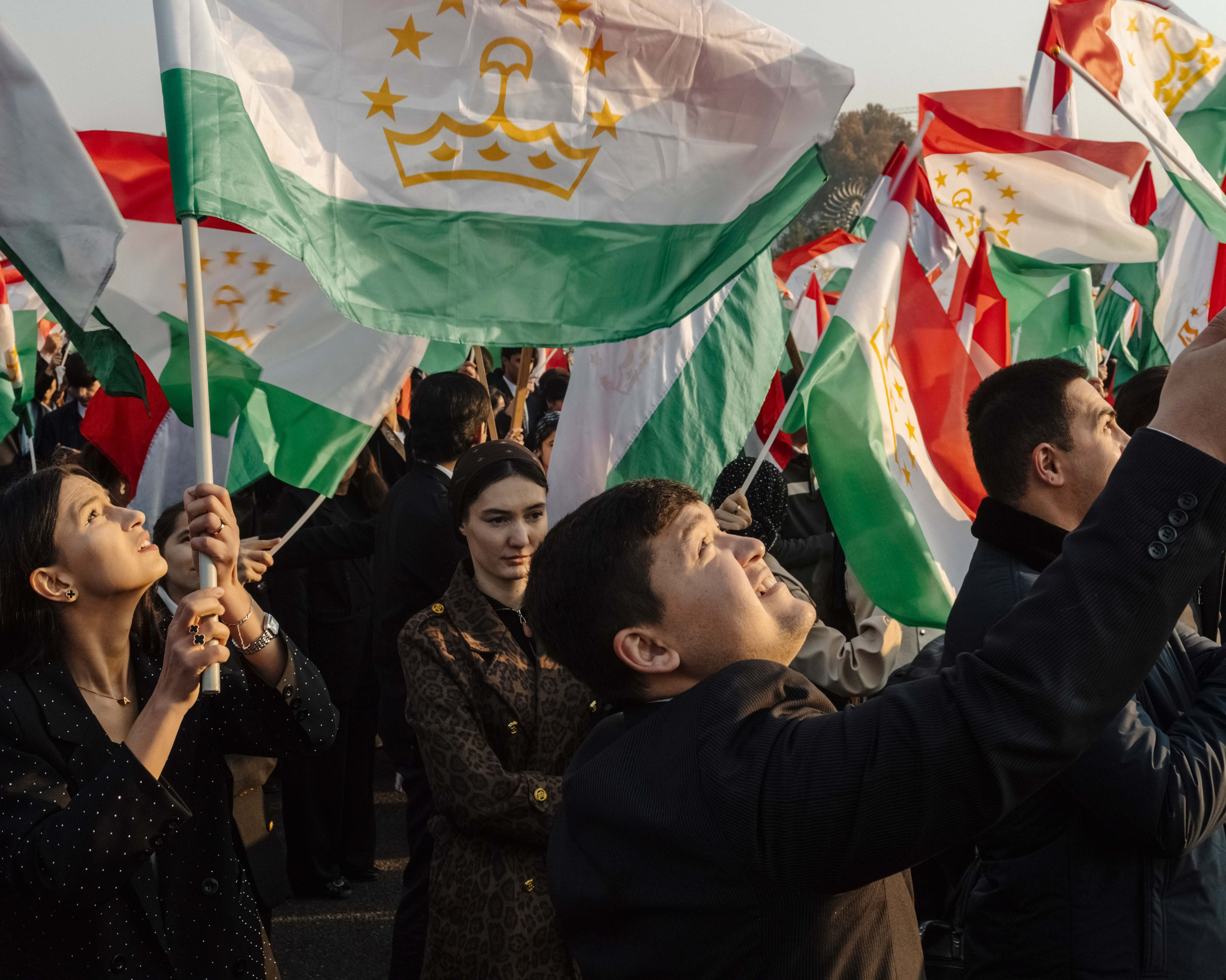 College students take part in a parade celebrating Flag Day on November 24, 2025, at Independence Square in Dushanbe.