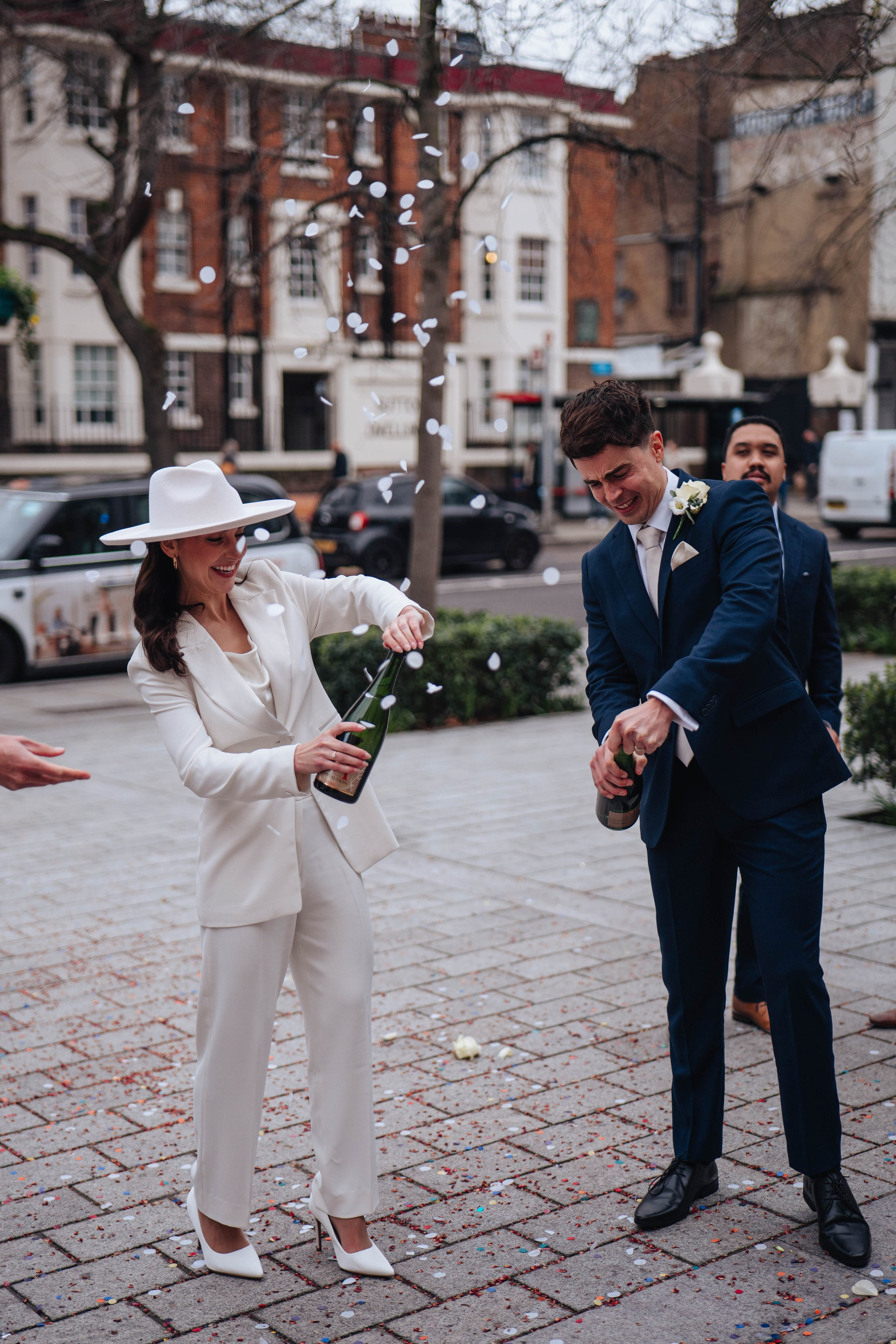 Exit from Islington town hall, champagne bottle opening 