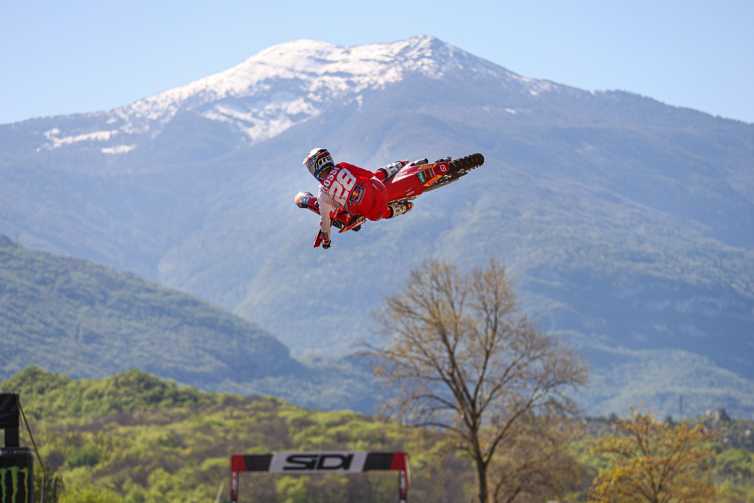 Marc Antoine Rossi Gasgas rider whiping with the dolomites in the backgroung MXGP of Trentino, Italy. Motocross World Championship