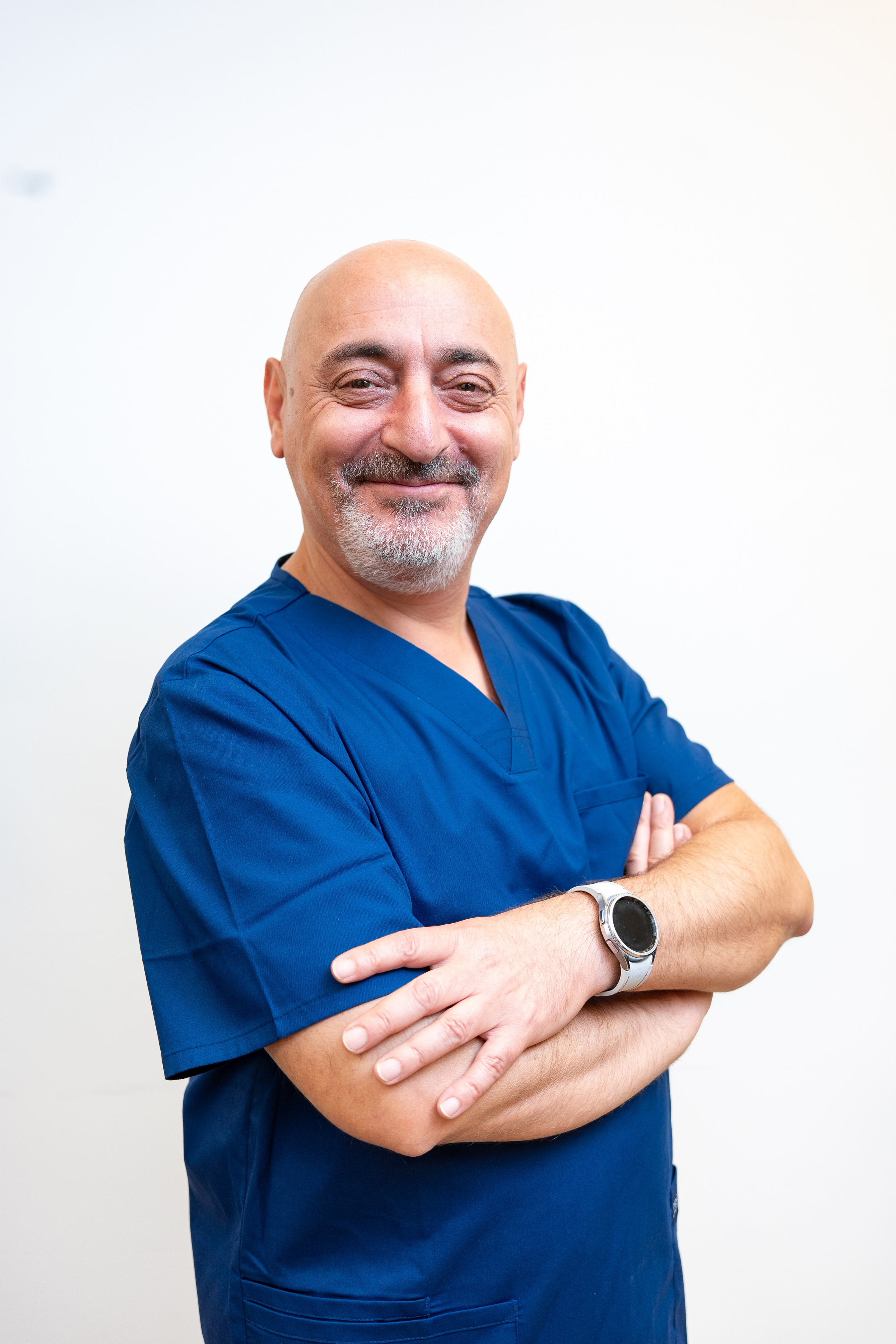 Senior male doctor in blue uniform