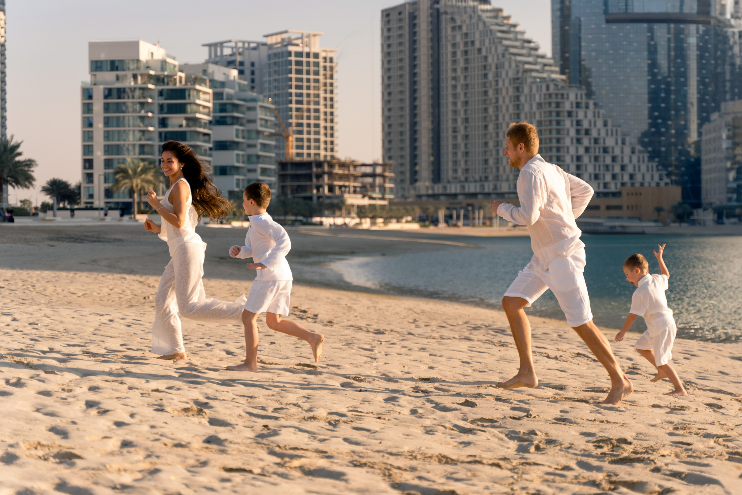 Family photography at Reem Island Abu Dhabi with skyline and sea view