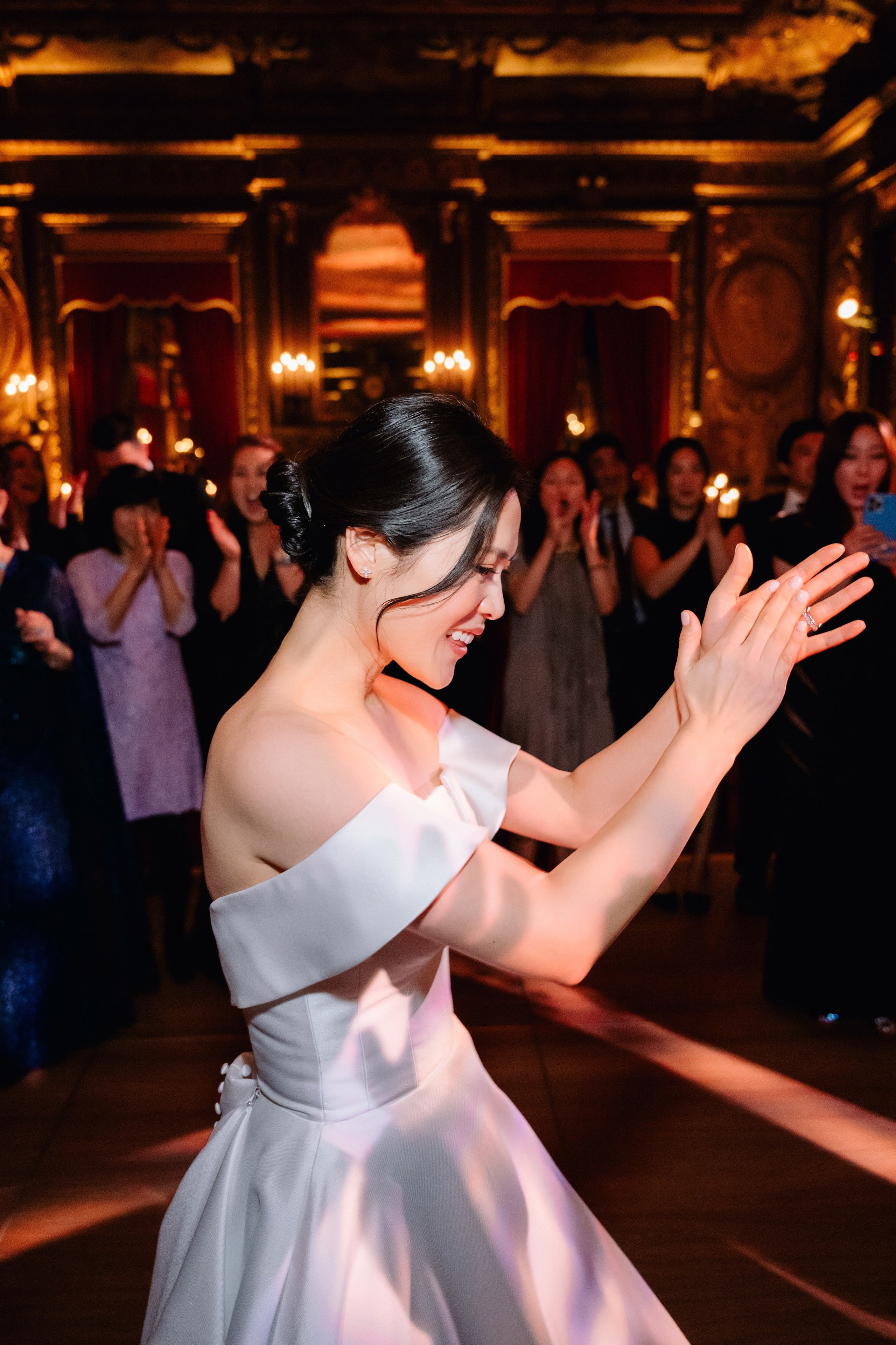 a woman in a white dress dancing on a dance floor