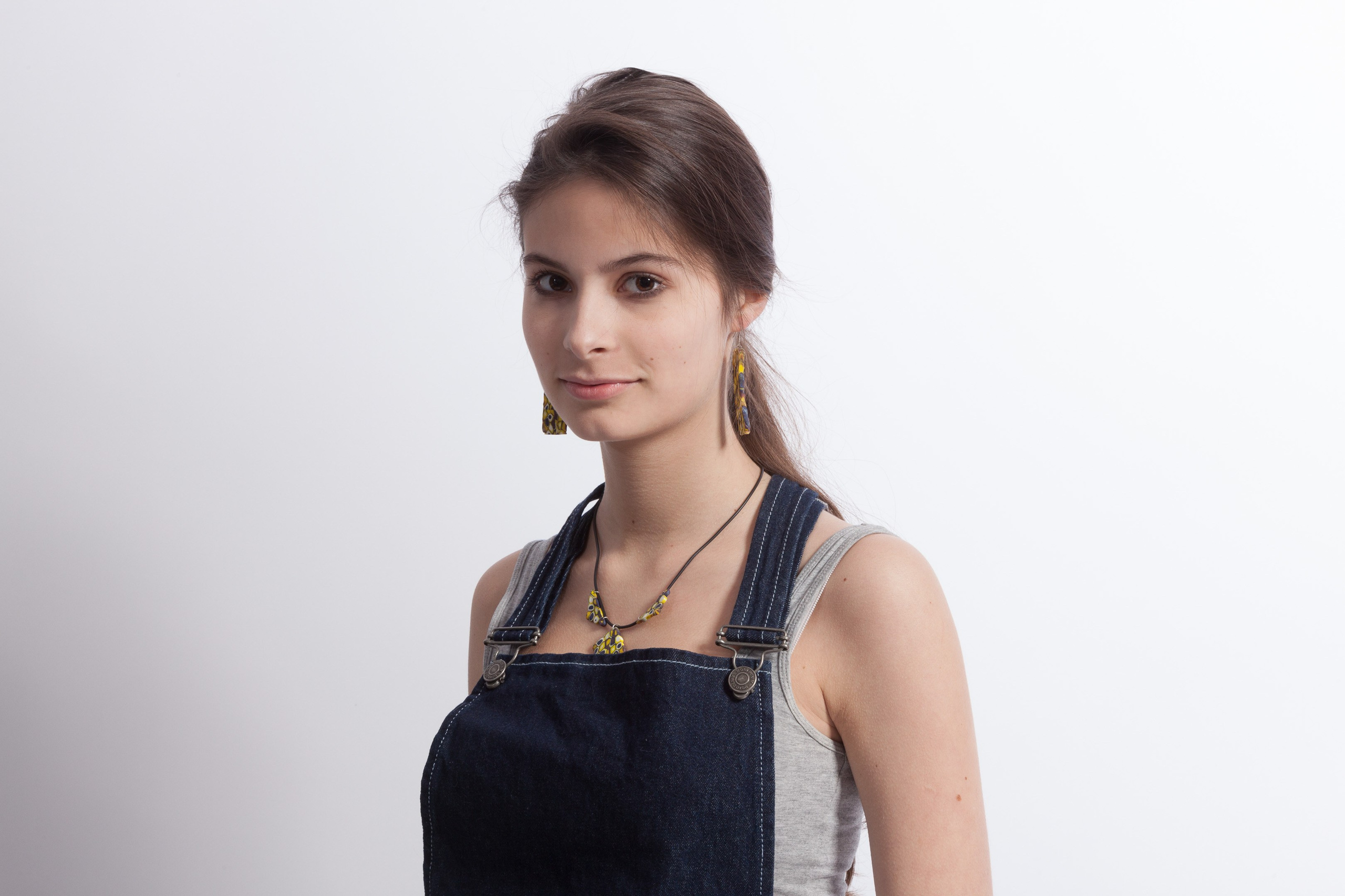 Portrait of a young girl on white studio background - photographer Andrey Dunin