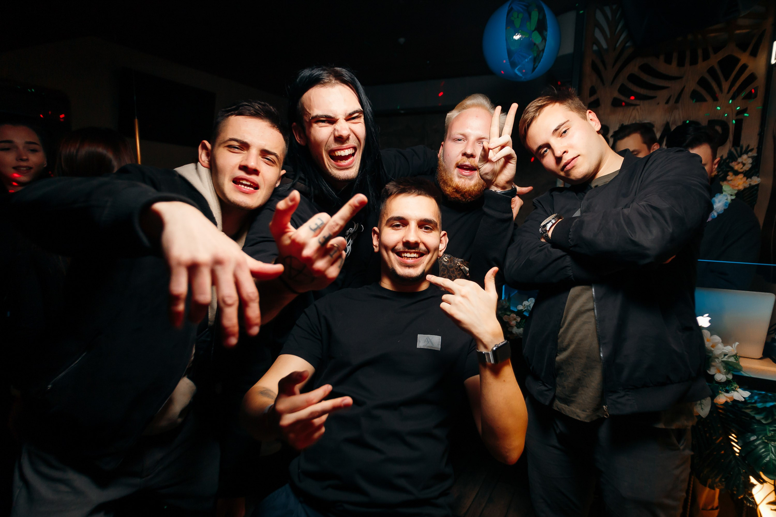 Group of friends posing at party, joyful moment