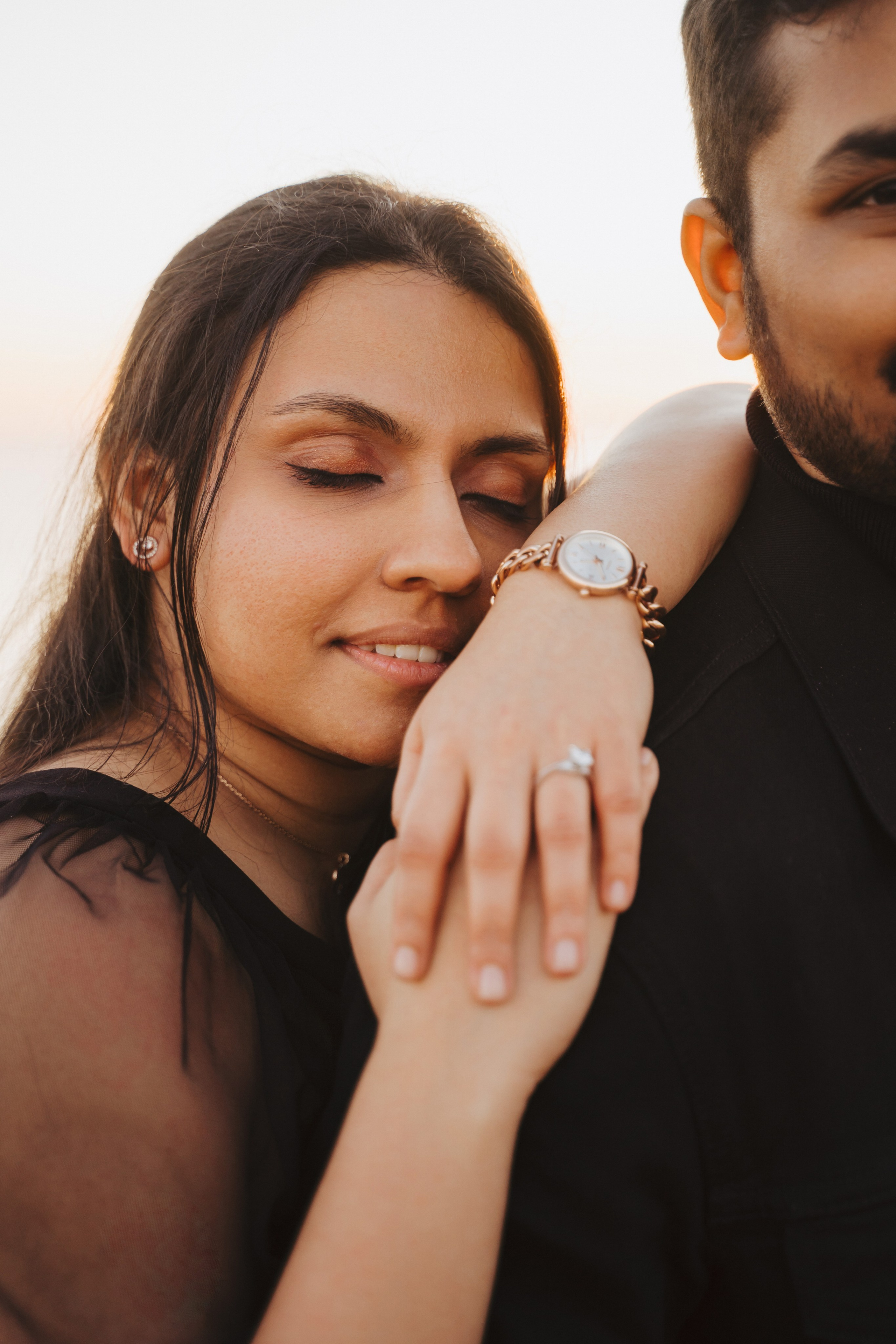 Proposal.  Overlooking the golden San Franisco Bridge sunset with a couple. Photographer Video. 