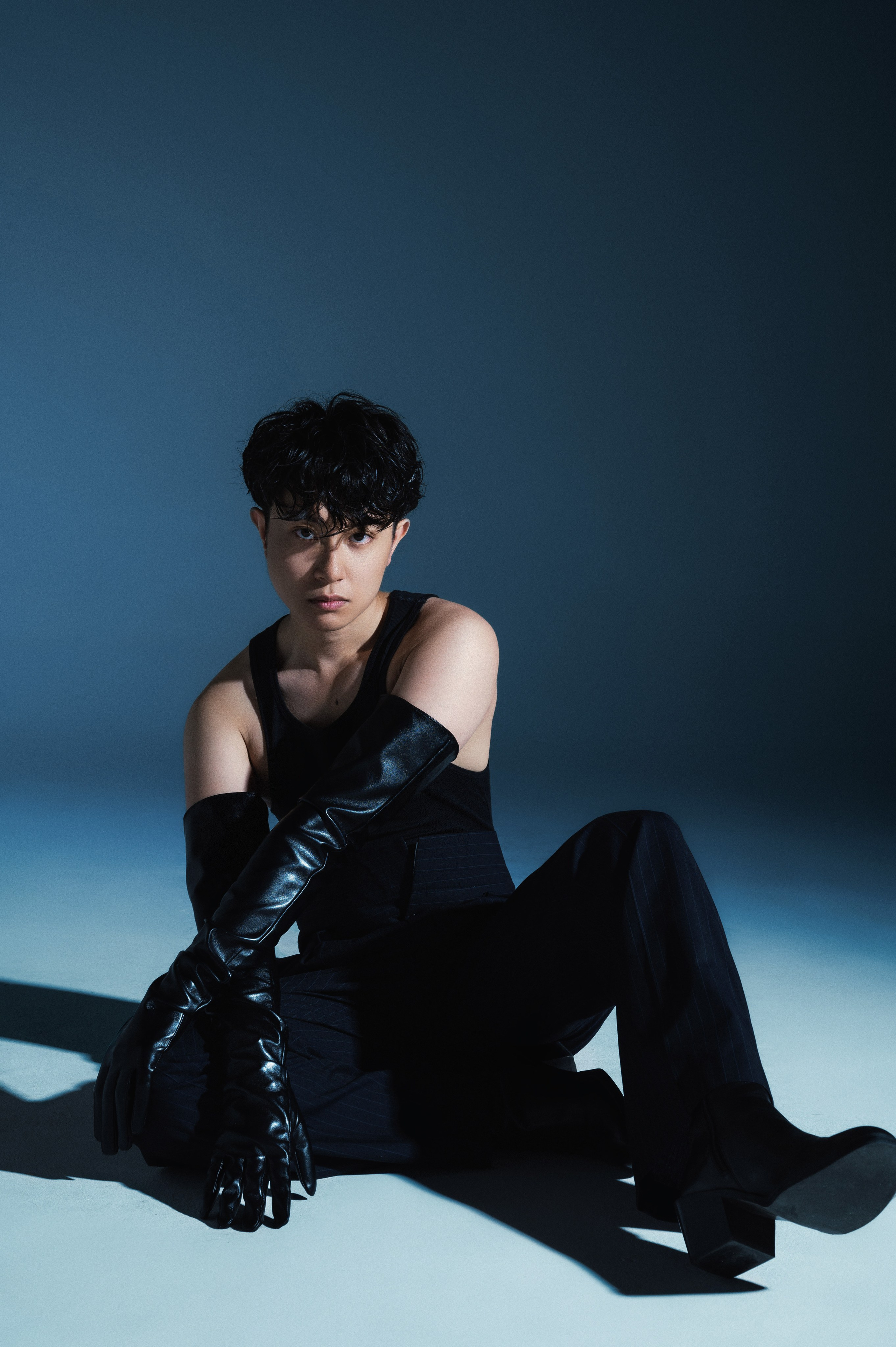 Male model portrait with dramatic hard light, editorial style fashion shoot in the studio in San Francisco.