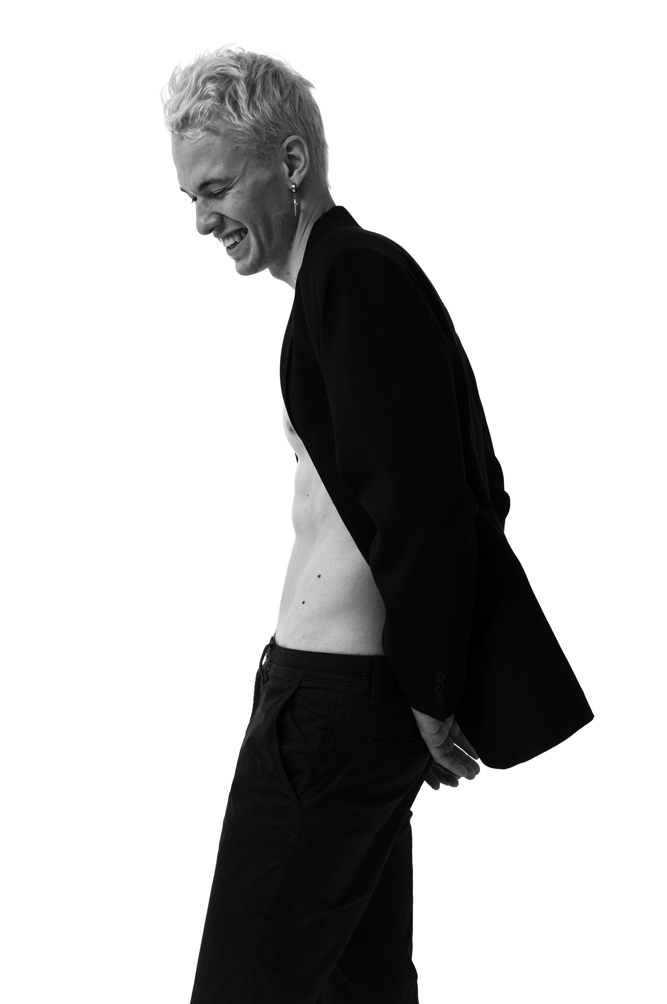 Male model test shoot, fashion portrait with magazine-level retouching.