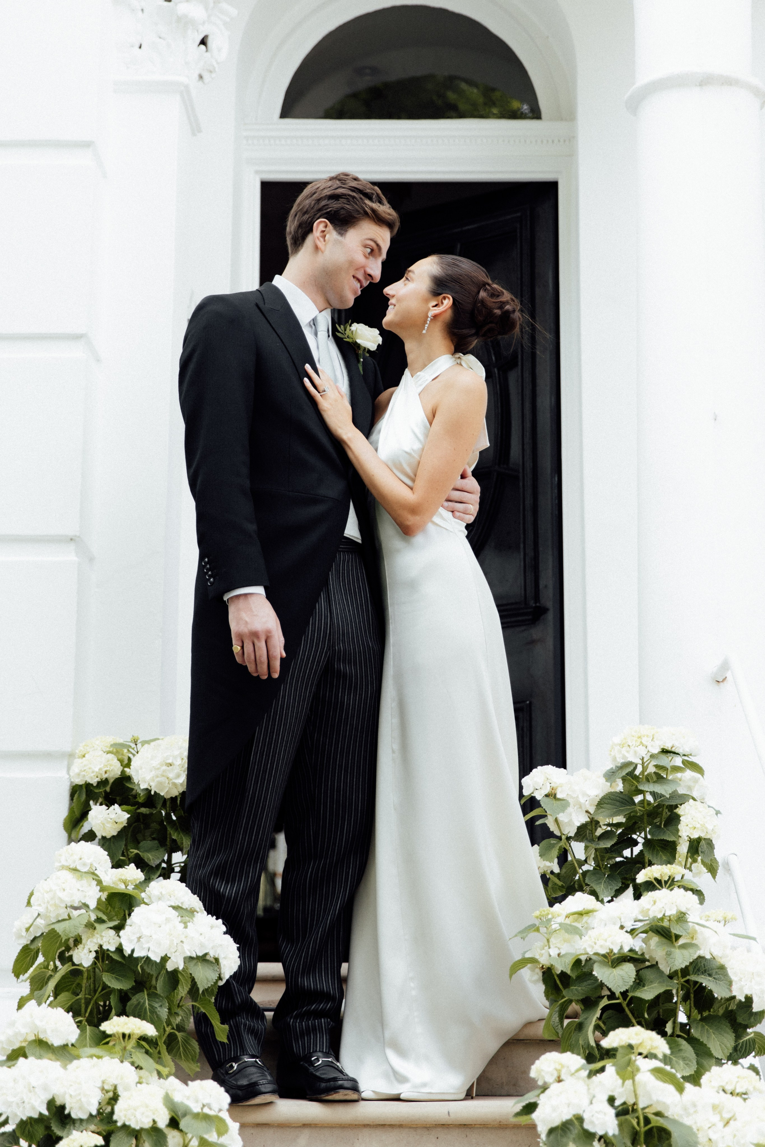Elegant wedding portrait of bride and groom walking through the streets of ParisRomantic elopement moment captured in soft evening light in Paris, FranceLuxury wedding ceremony setup in a historic French venue with natural floralsCandid black and white photo of a couple at their city wedding in London, UKTimeless couple portrait in front of Marylebone Town Hall, LondonEditorial-style bridal preparation in a classic townhouse in the heart of LondonSoft light bridal portrait in a countryside château wedding in FranceFine art flat lay with French-inspired wedding details and vintage texturesCinematic golden hour photo at a UK estate wedding with historic architectureLuxury wedding tablescape with candles and florals at a London reception