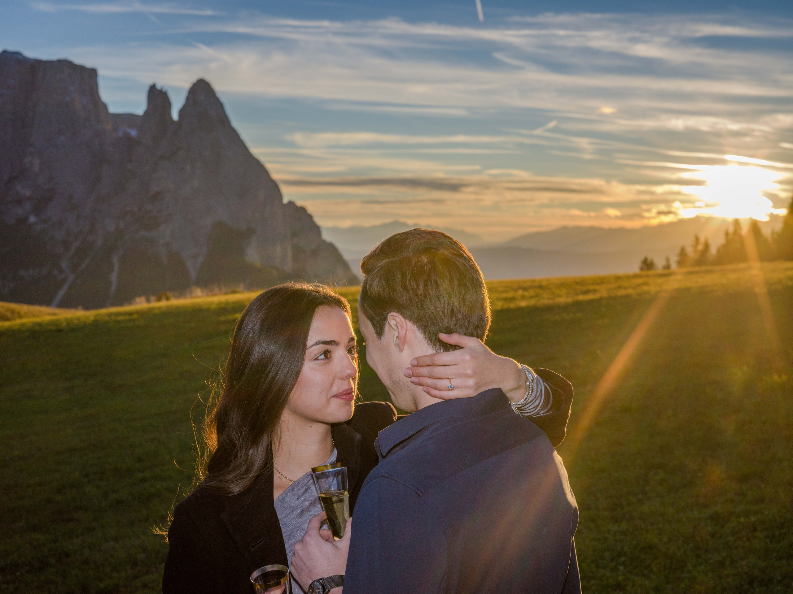 Sunset engagement photo session in glowing Dolomites.