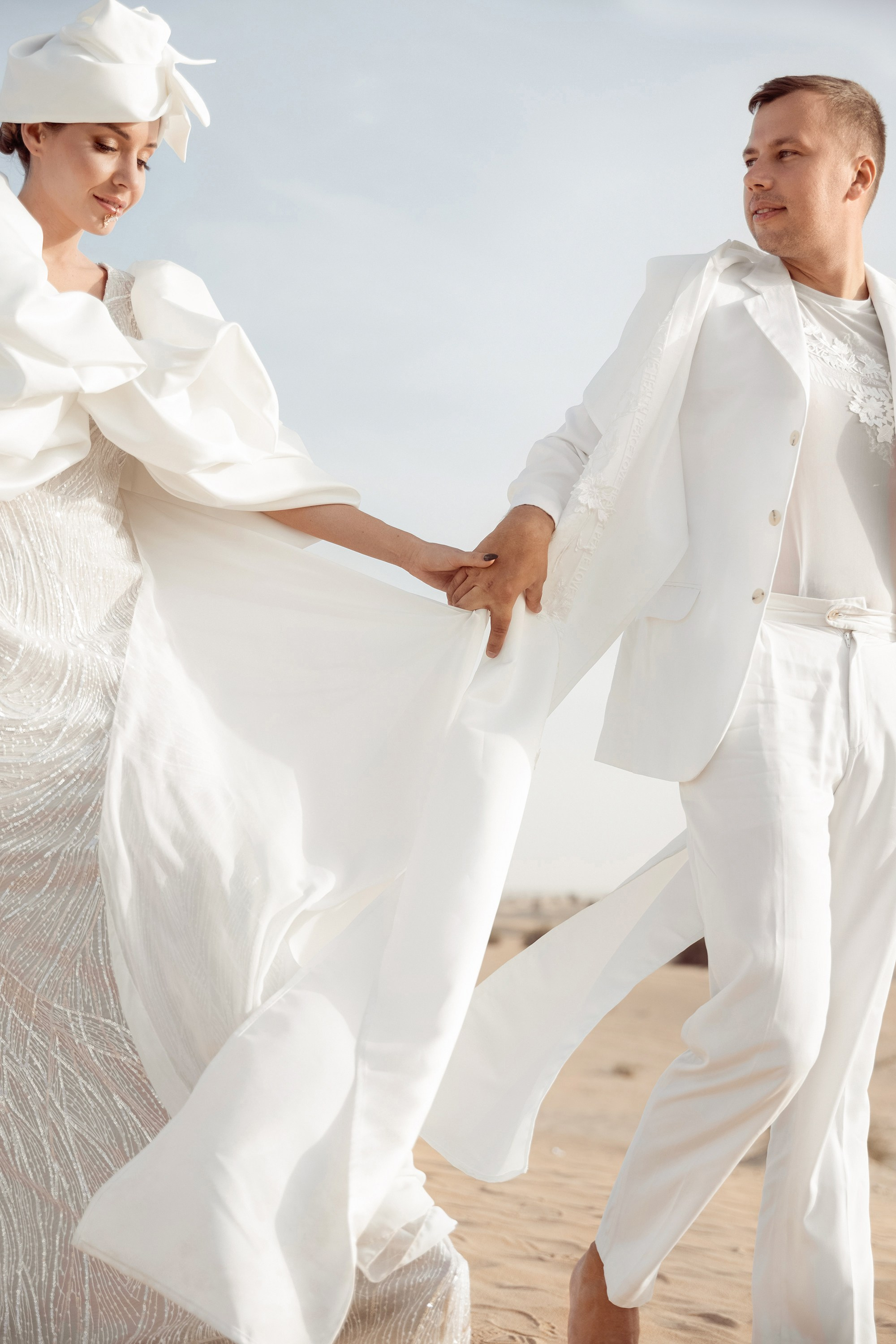 Bride is holding a groom's hand. Dubai, United Arab Emirates