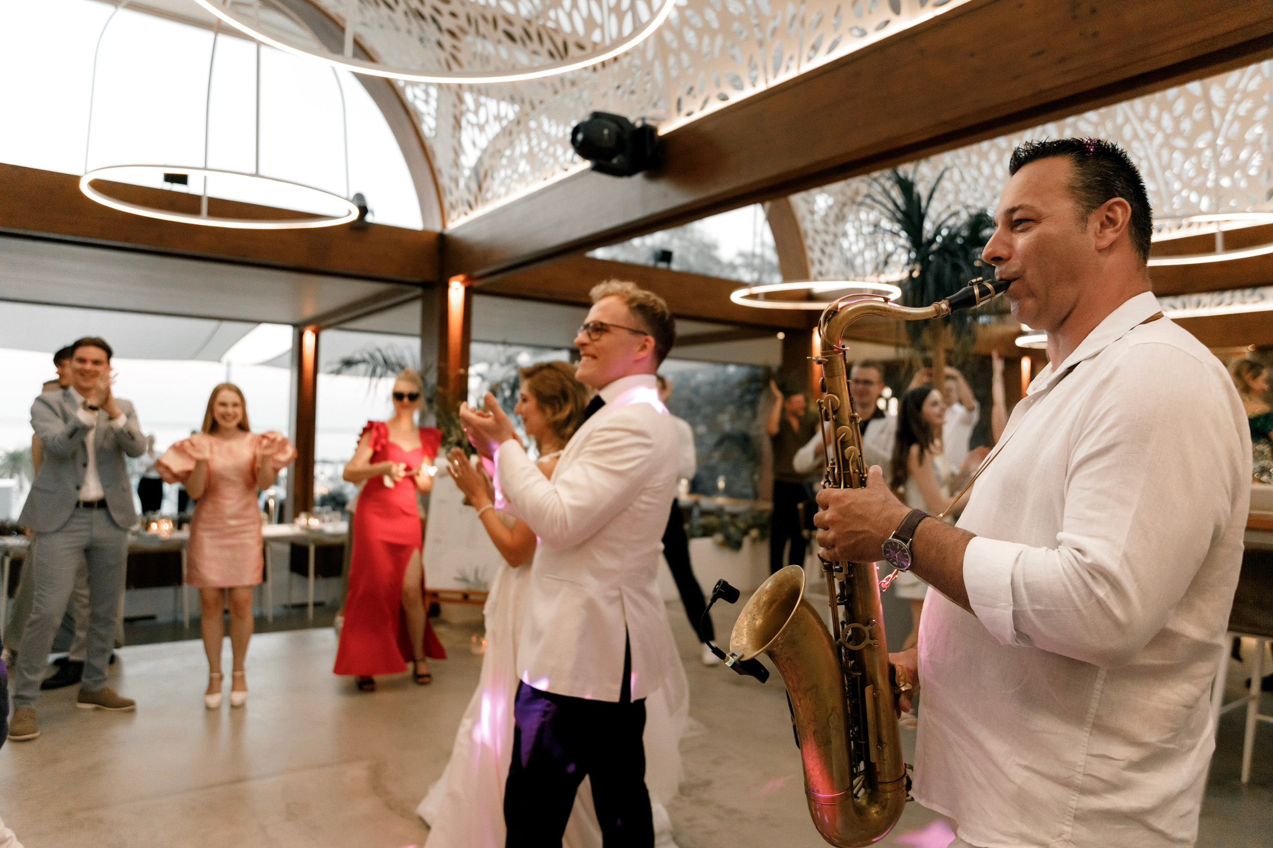 Bride and groom are coming inside the restaurant and see the Wedding guest contests in Lithuanian wedding. Rhodes Greece