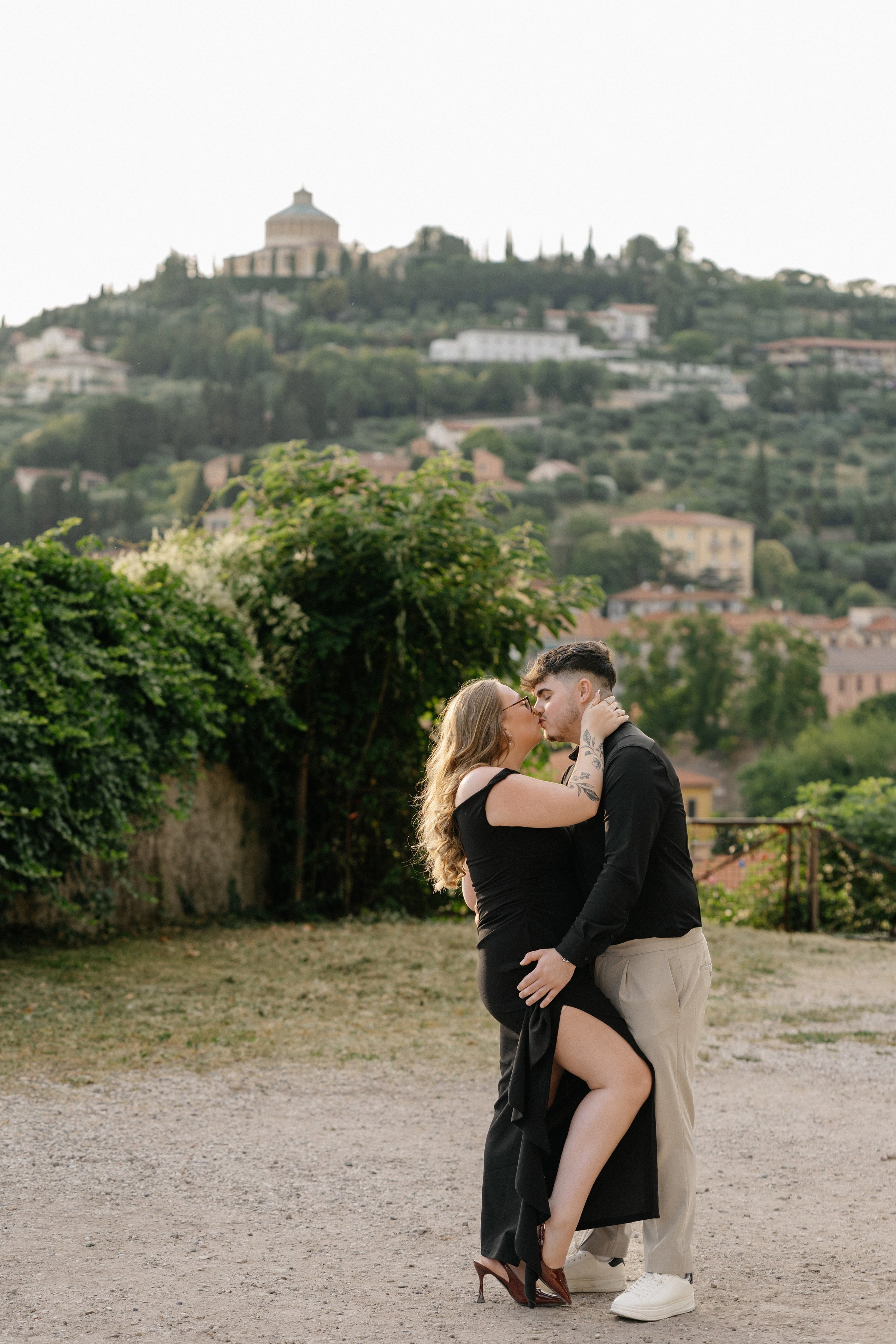 Couple dancing together after a surprise proposal at Castel San Pietro