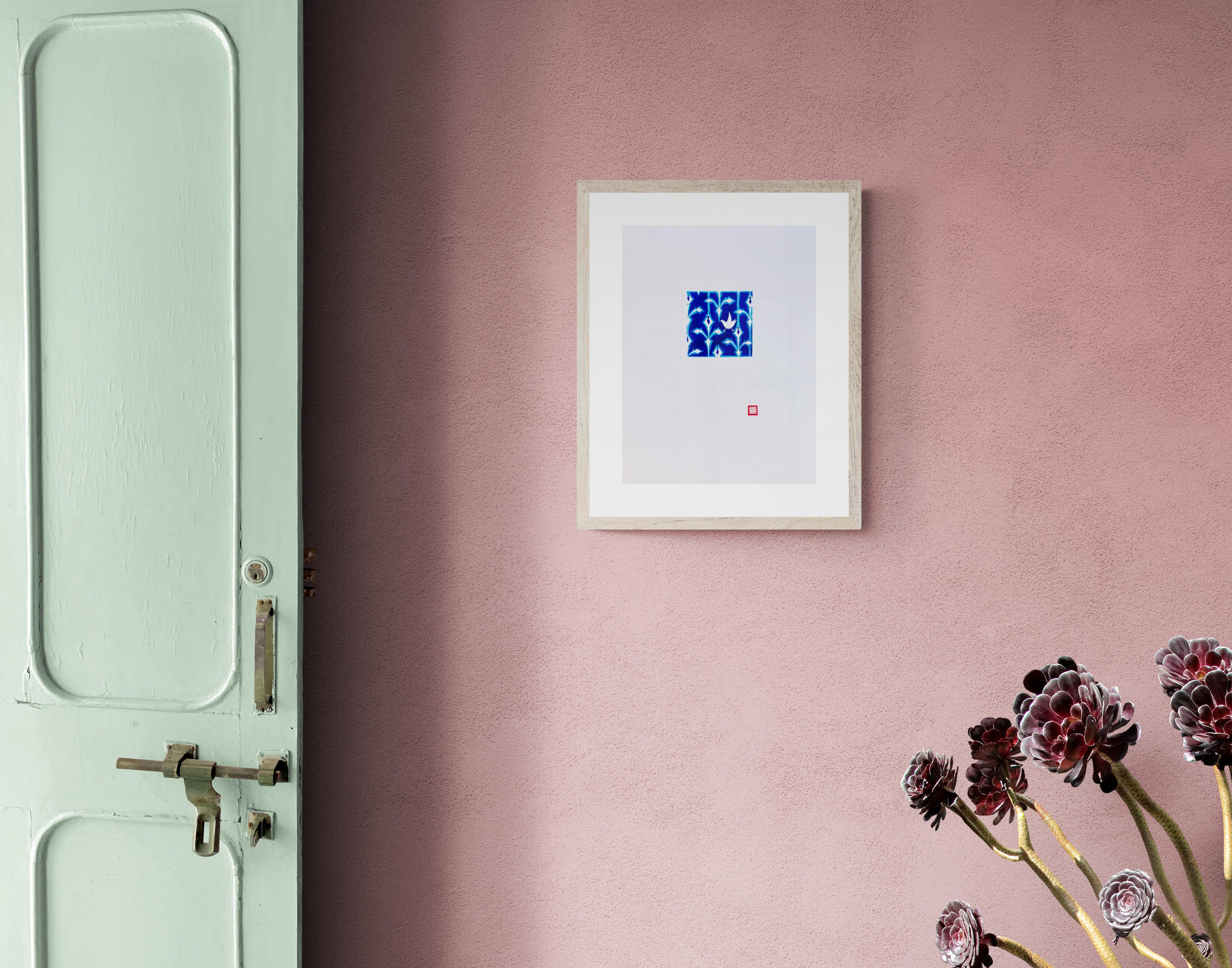 Decorative digital print in blue and white, floral image inspired by artistic ceramics and Nordic modernism, designed for elegant and contemporary interiors. Example on a pink wall.