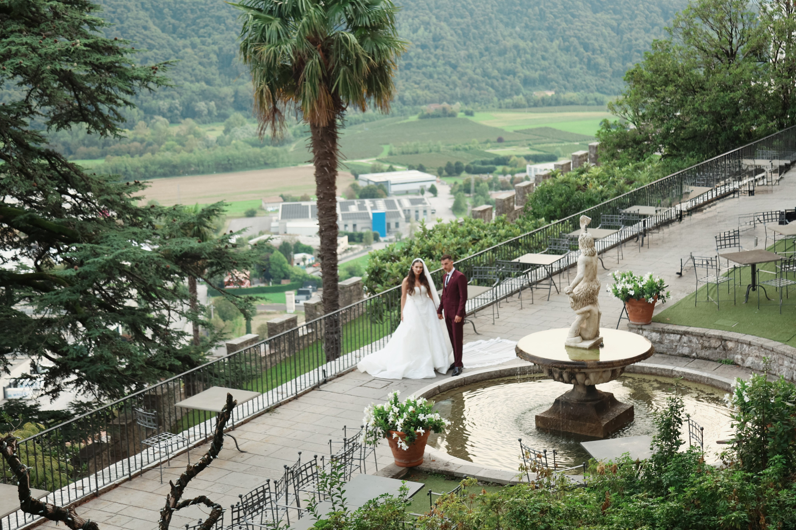 Candid shot of the couple against the backdrop of CastelBrando.