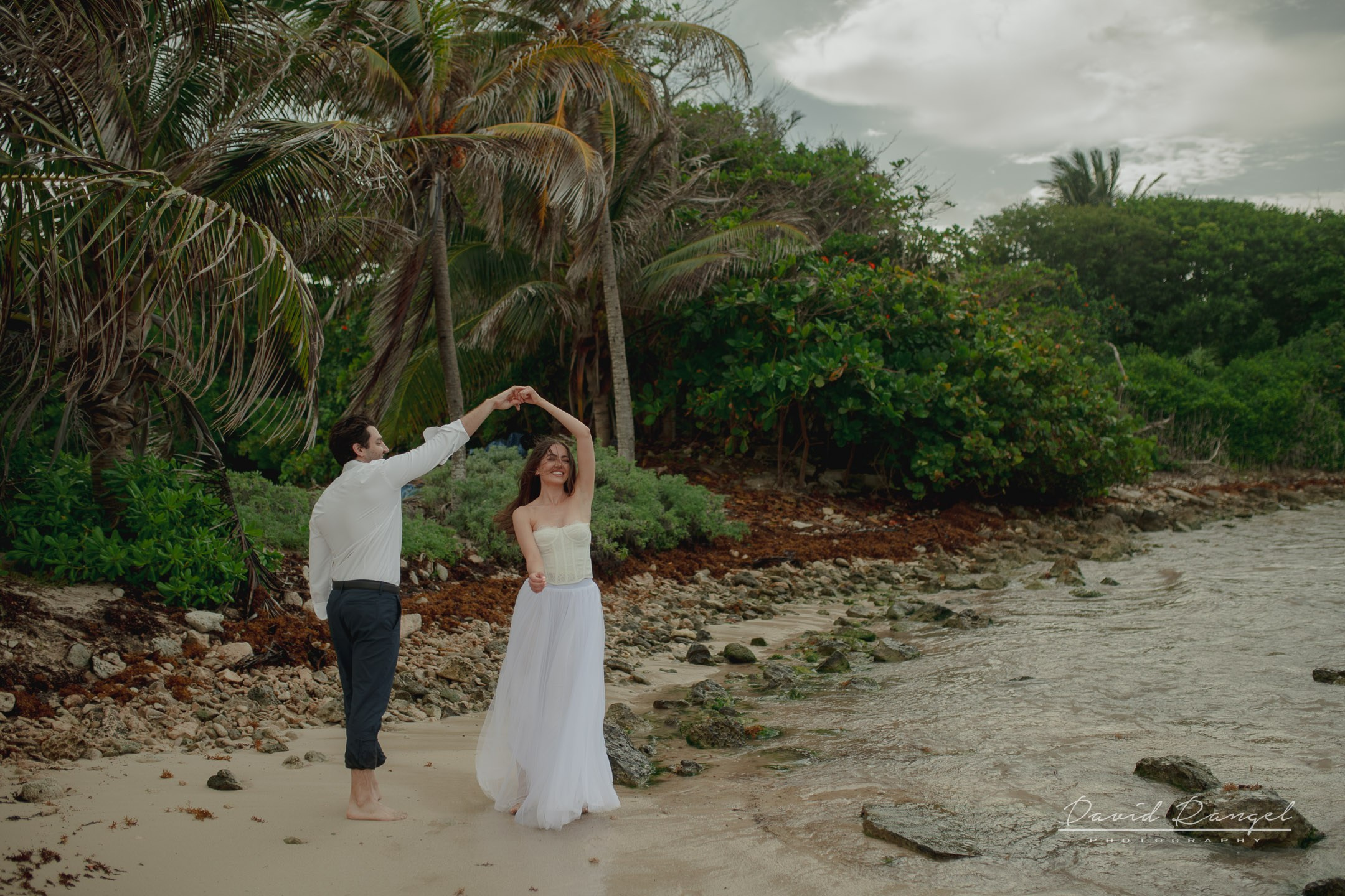 Secilia and Brandon tras the dress at the Conrad Tulum Hotel. Destination wedding photographer based in Cancun and Riviera Maya with service worldwide