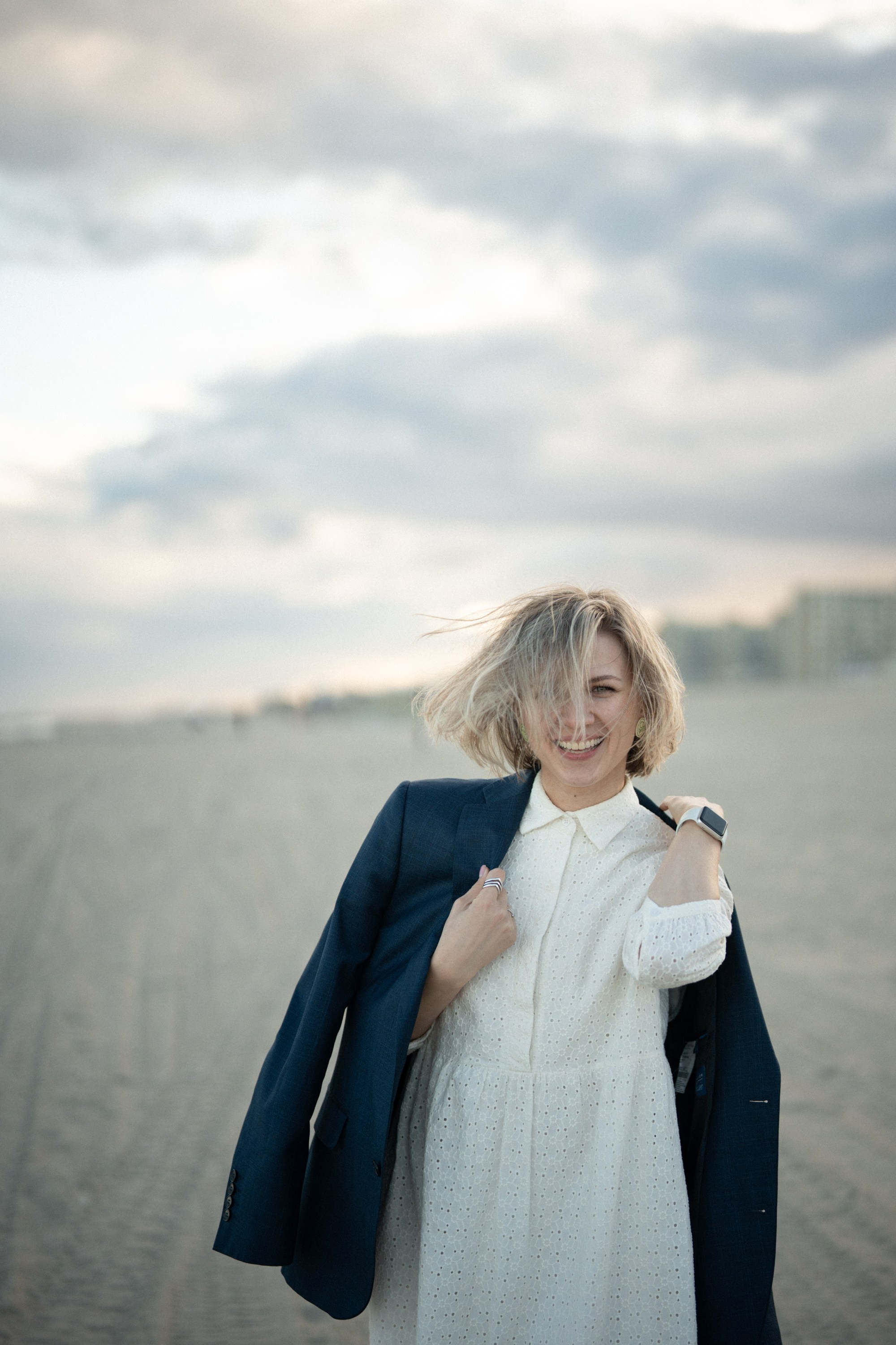 Candid photos of a couple on the beach. Portrait and wedding photographer in New York