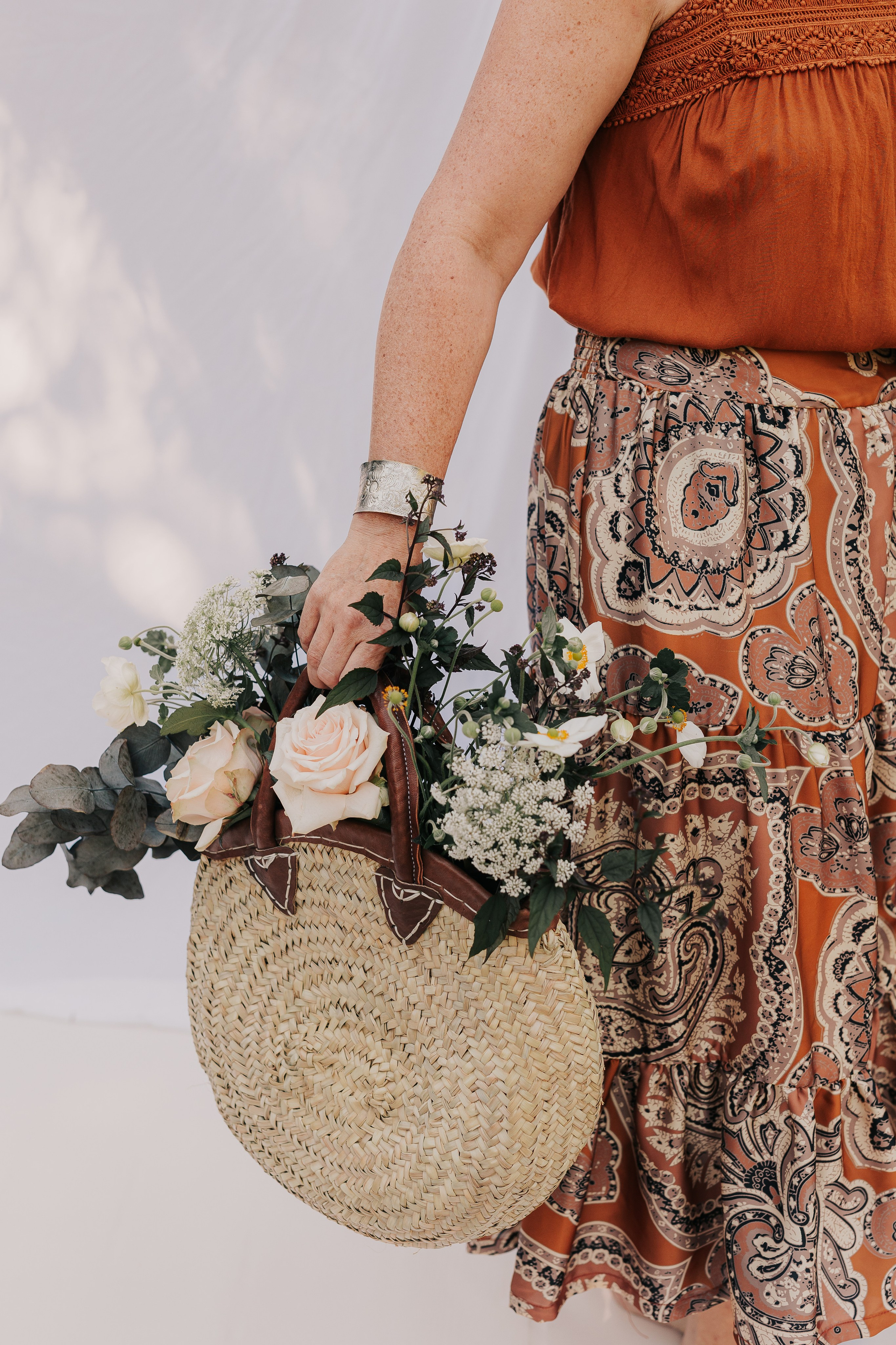 close up of a woven bag full of flowers 