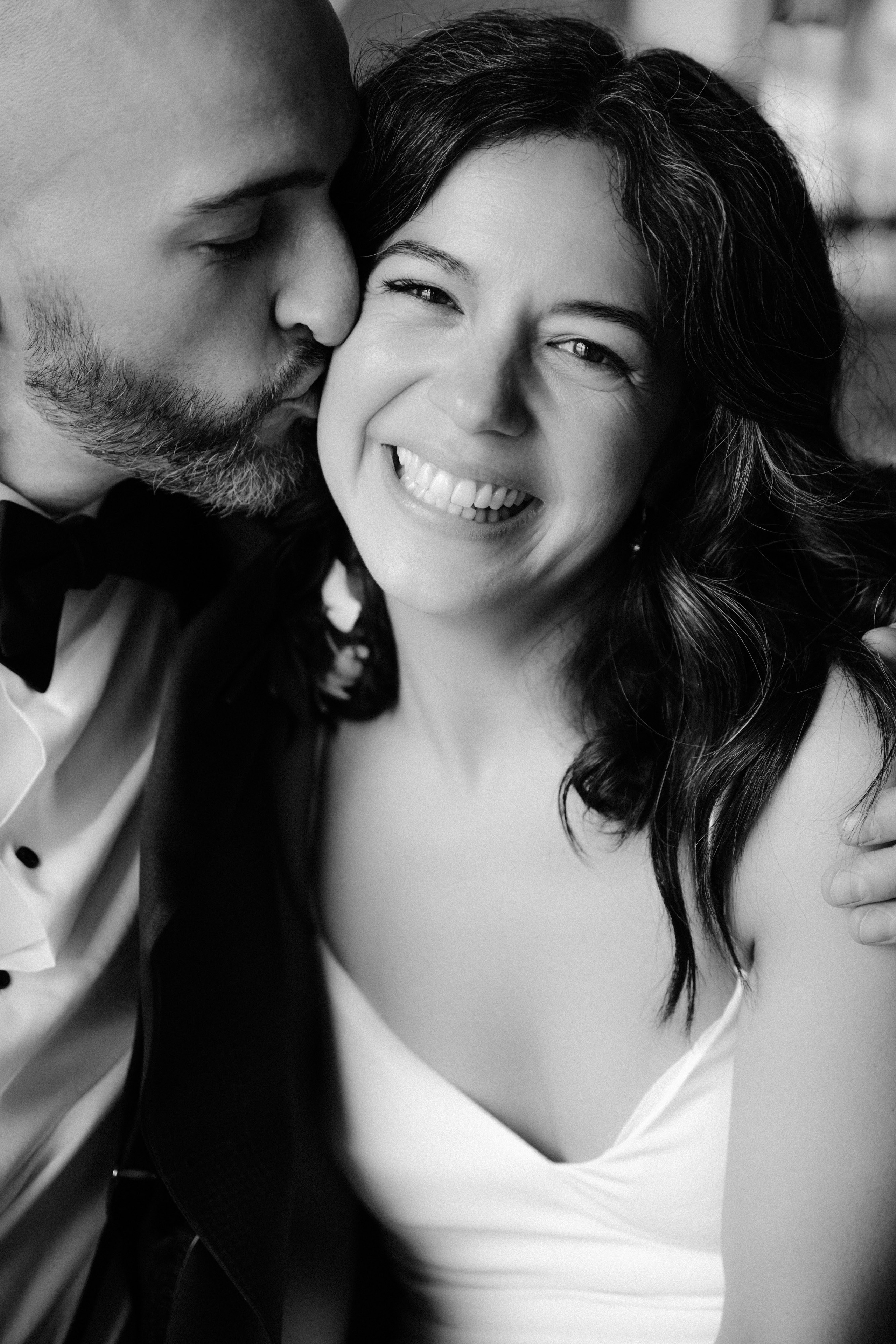 a man and woman are smiling at each other people