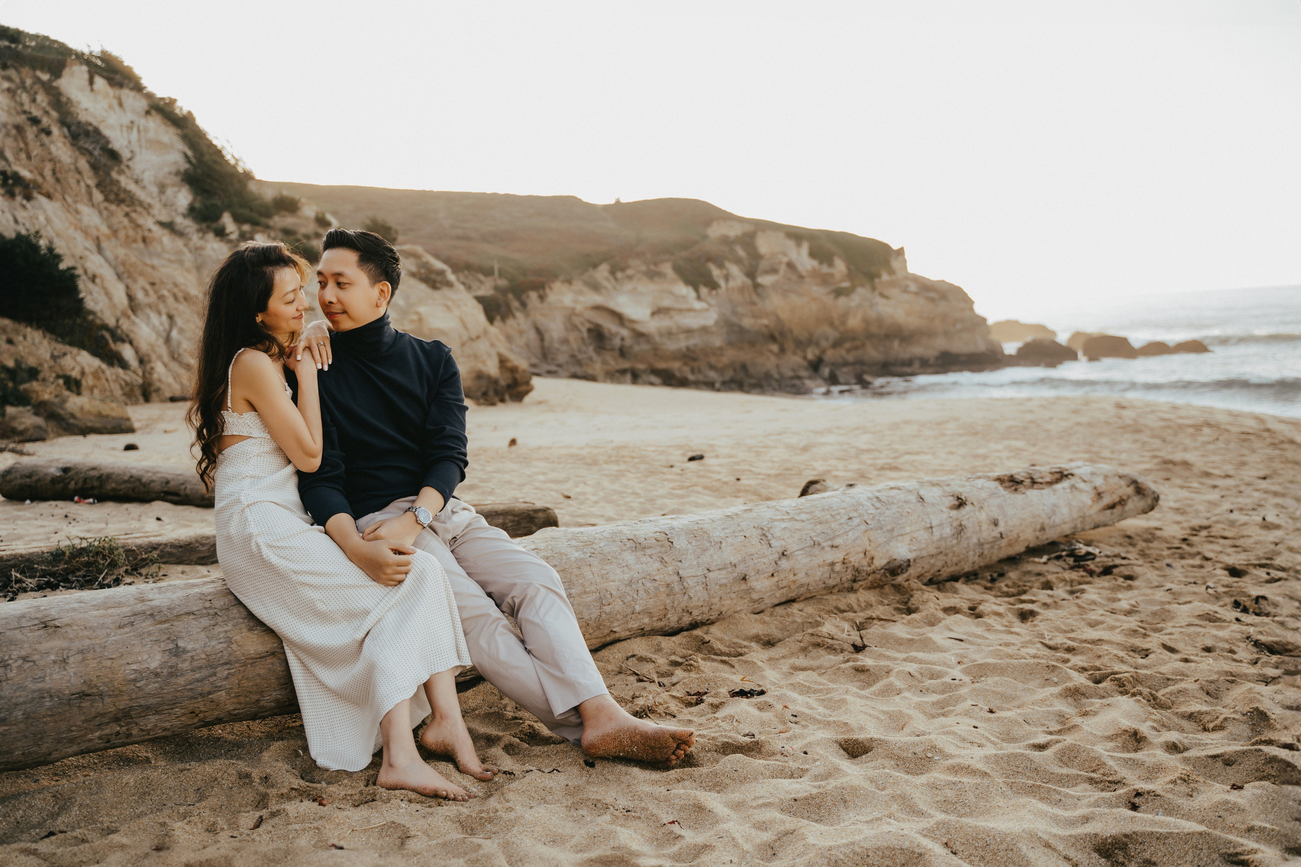 A photo shoot on the San Francisco beach at sunset. Engagement session. 