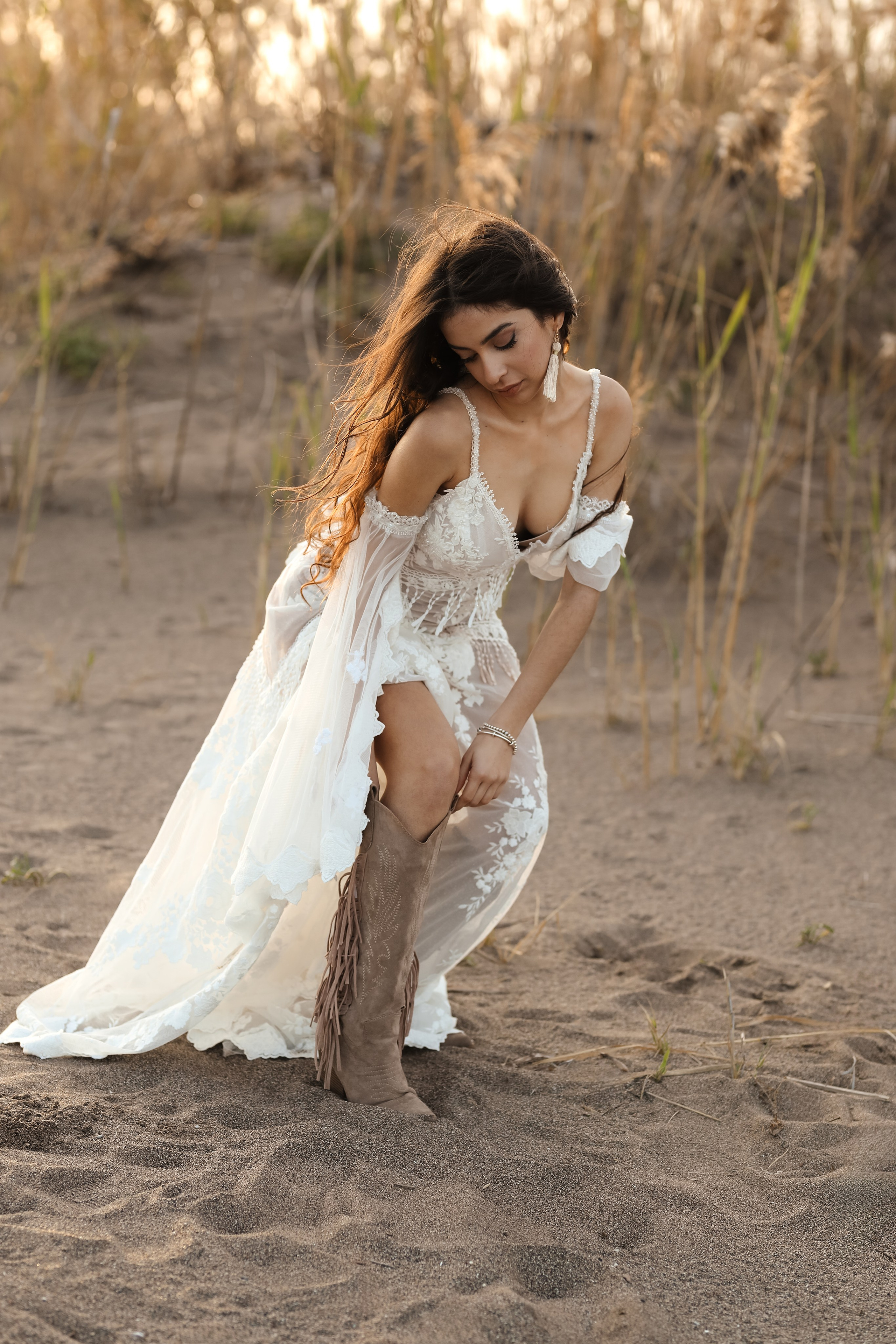 A portrait of girl in a wedding dress on a sunset background. Rhodes, Greece
