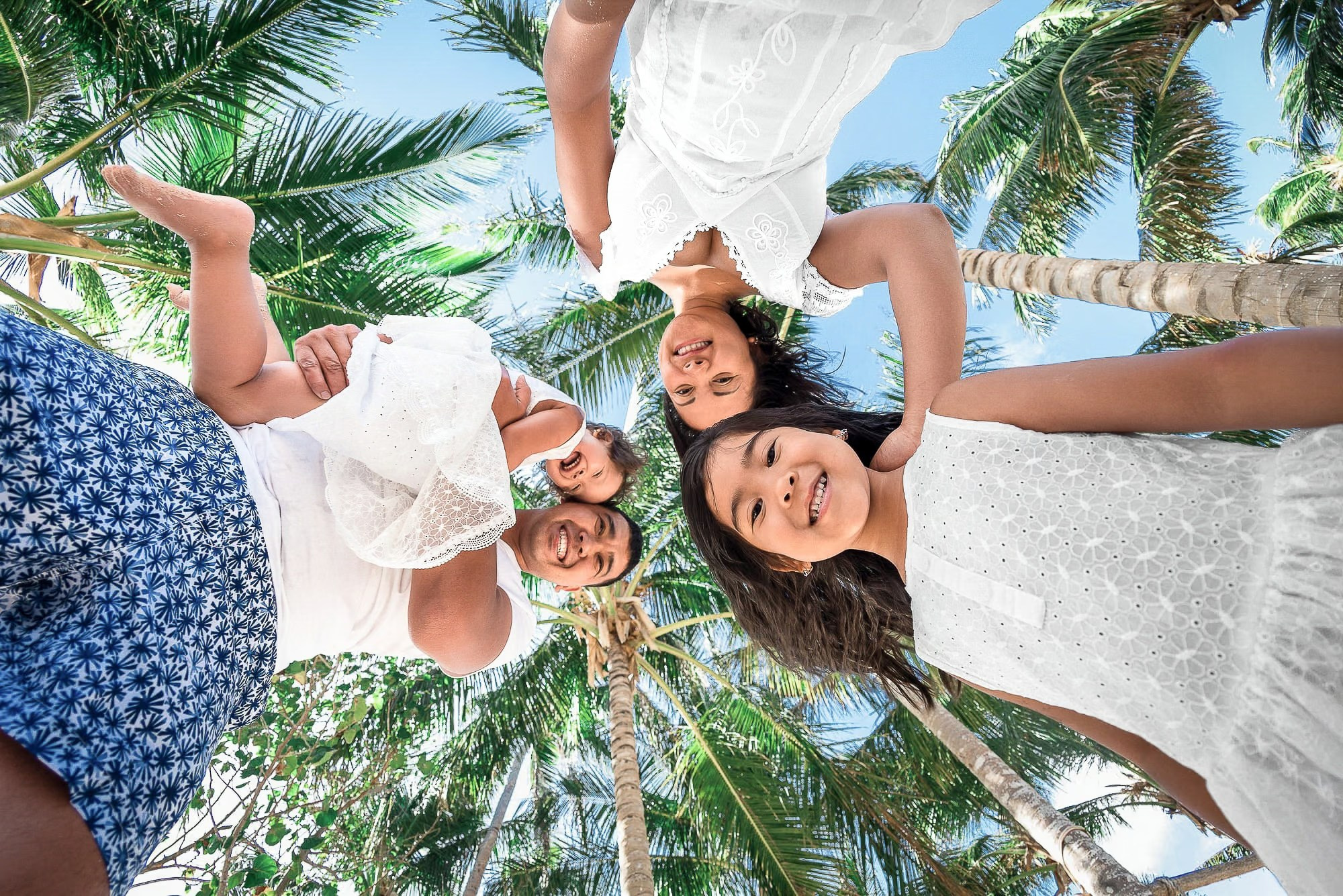 Family photography session in Punta Cana capturing joyful moments on a Caribbean beach.
