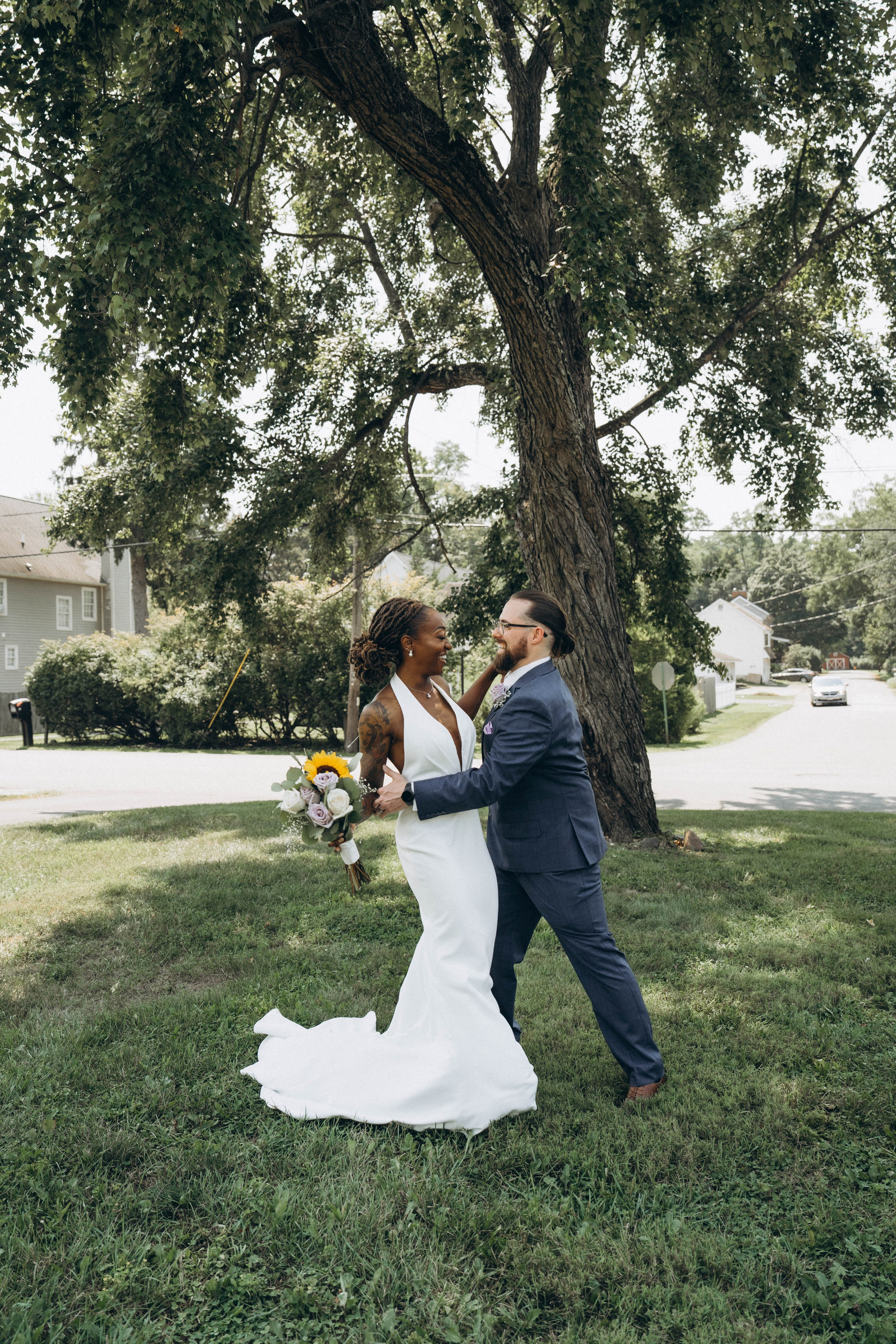 Documentary-style candid of bride laughing with groom in Upstate New York