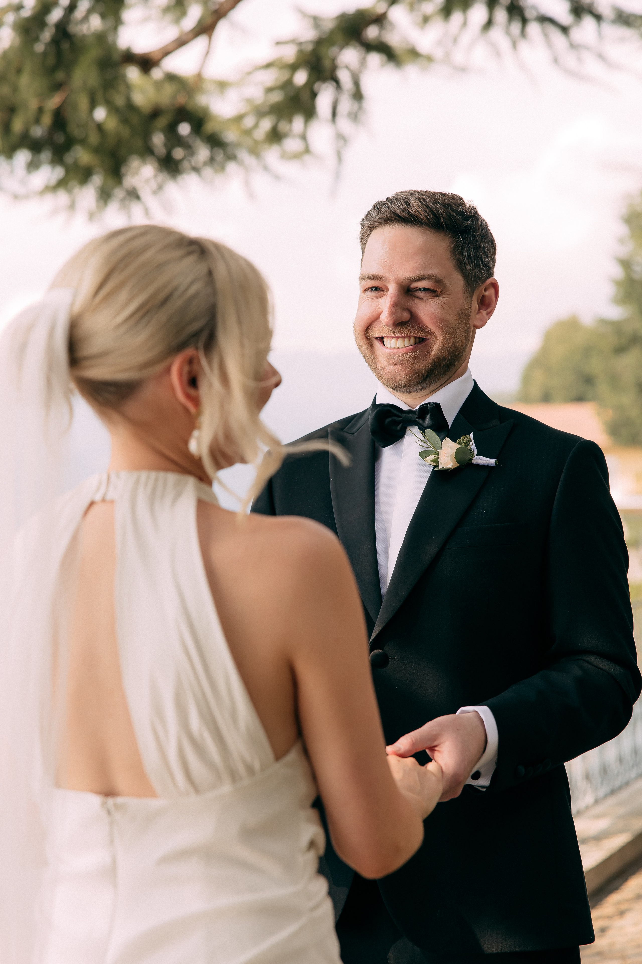 Groom smiling at his bride during their Lake Como elopement at Villa Lario, Italy