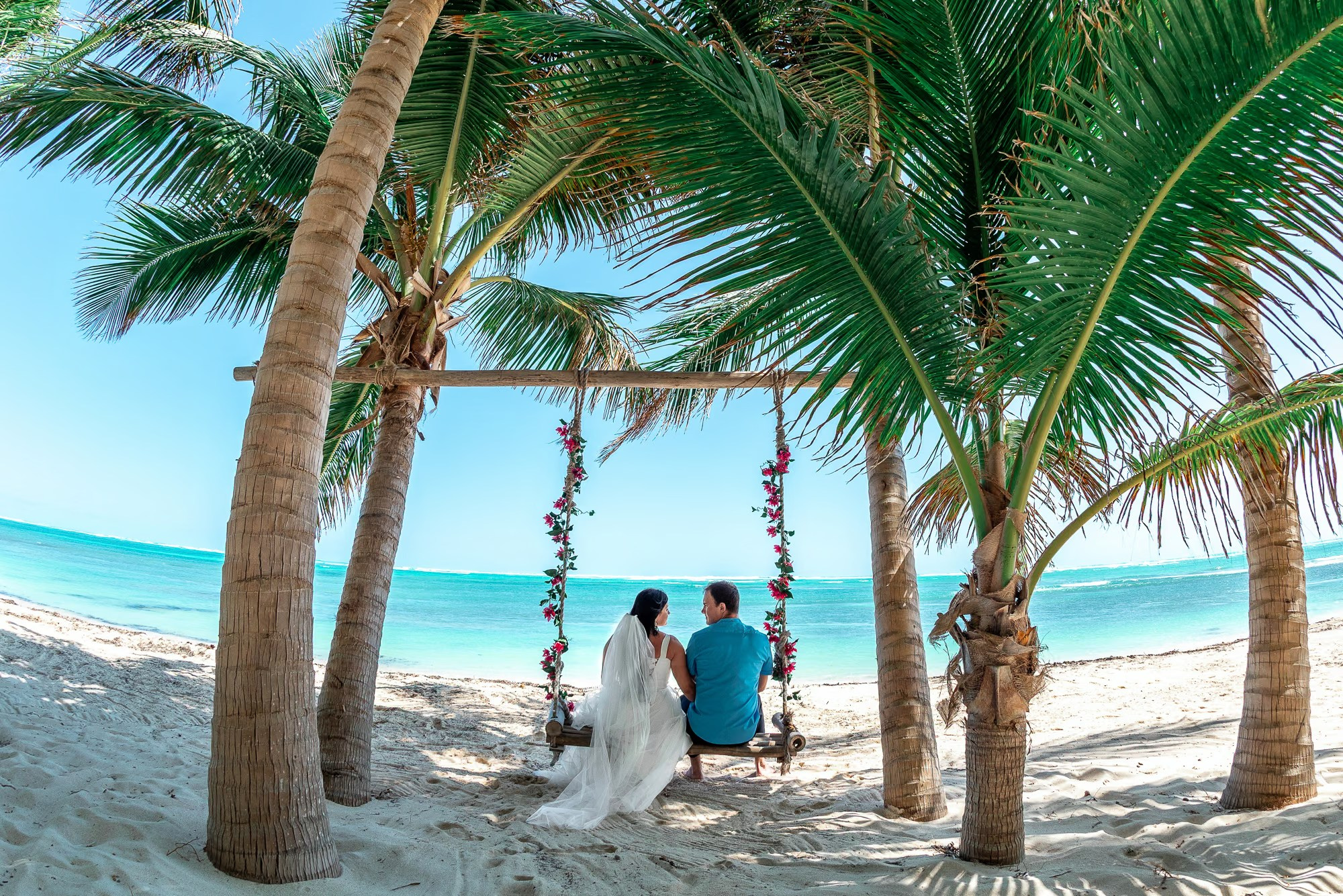 Punta Cana engagement photographer capturing a loving couple by the Caribbean Sea.