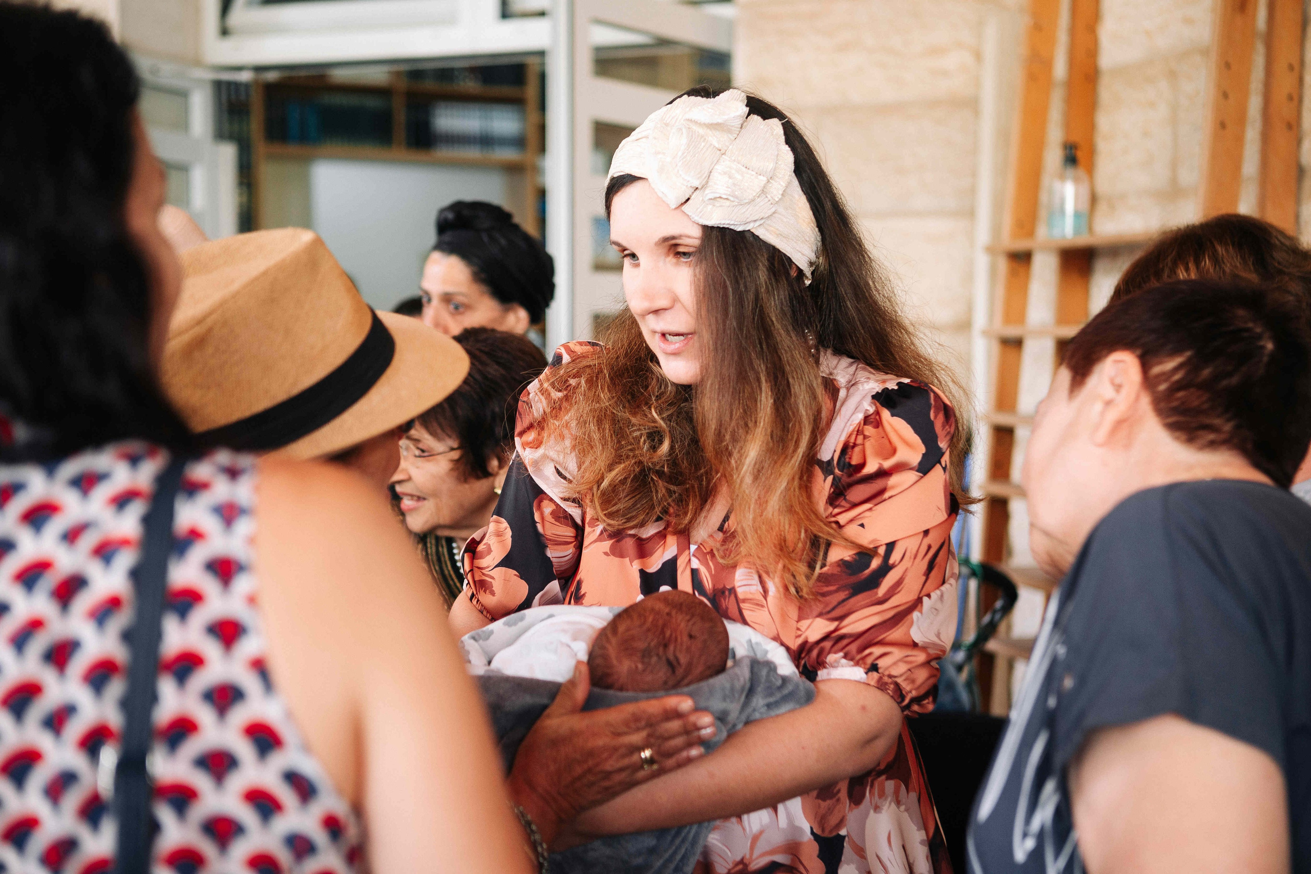 BRITH MILA IN THE SMALL SYNAGOGUE. PHOTOGRAPHER IN ISRAEL