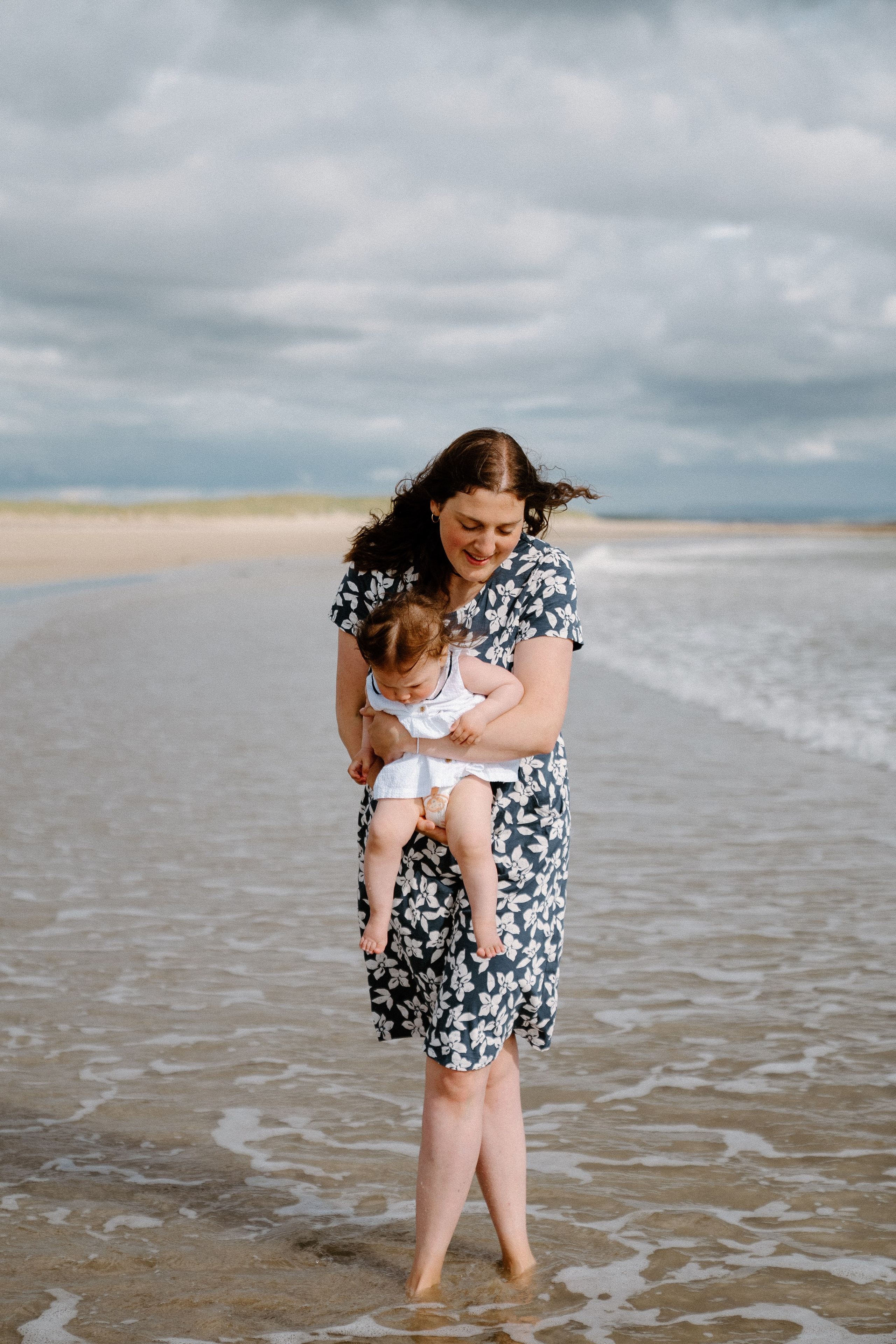 Darya and Mia at the ocean. Wedding and family photographer Ireland