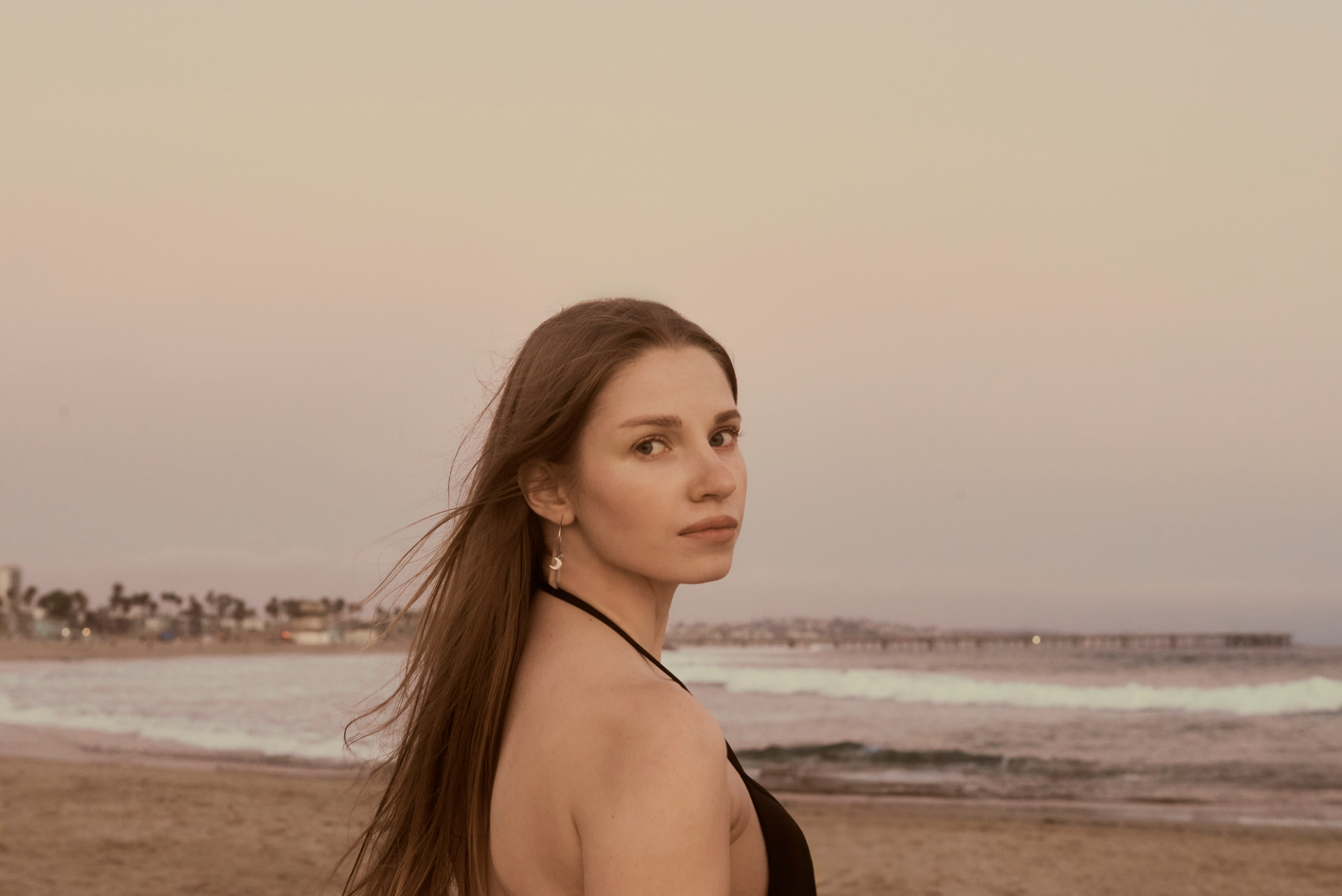 Delicate photo of a girl with a beautiful beach backdrop in Los Angeles