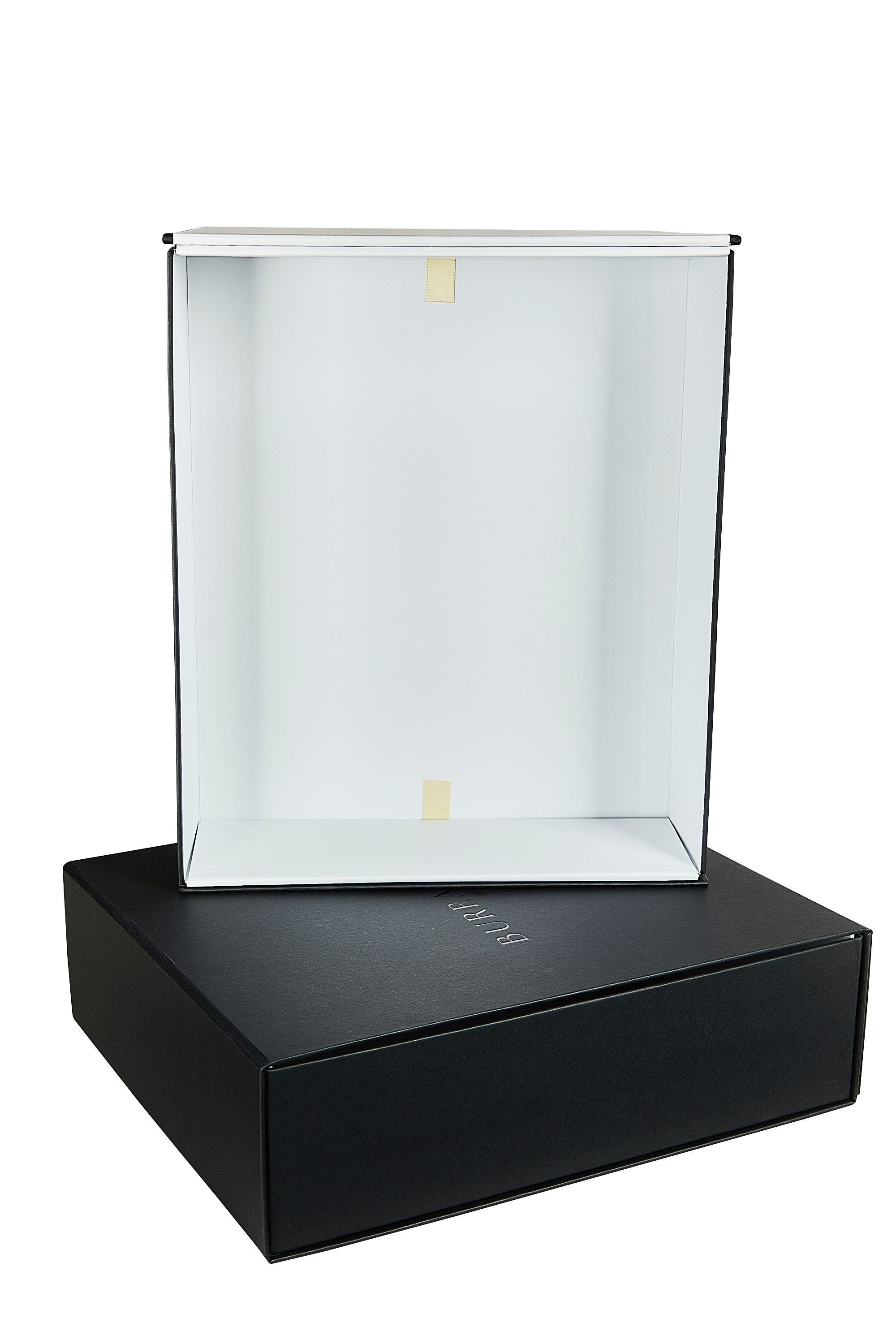 Photographer Roman Djuzev - Photograph of cardboard box for three bottles of wine with the company logo. The box is black on the outside and white on the inside, photographed against a white background.