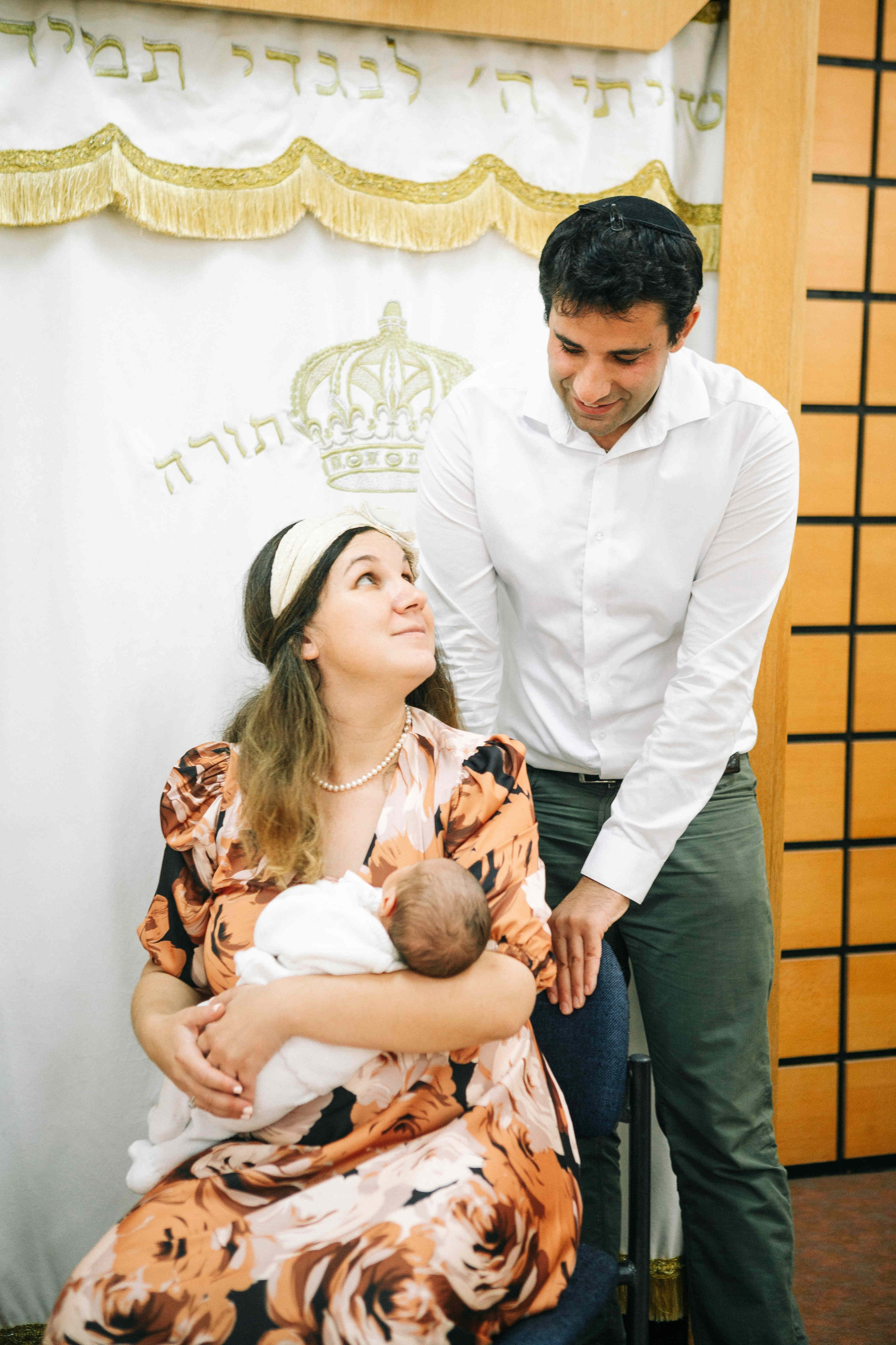 BRITH MILA IN THE SMALL SYNAGOGUE. PHOTOGRAPHER IN ISRAEL