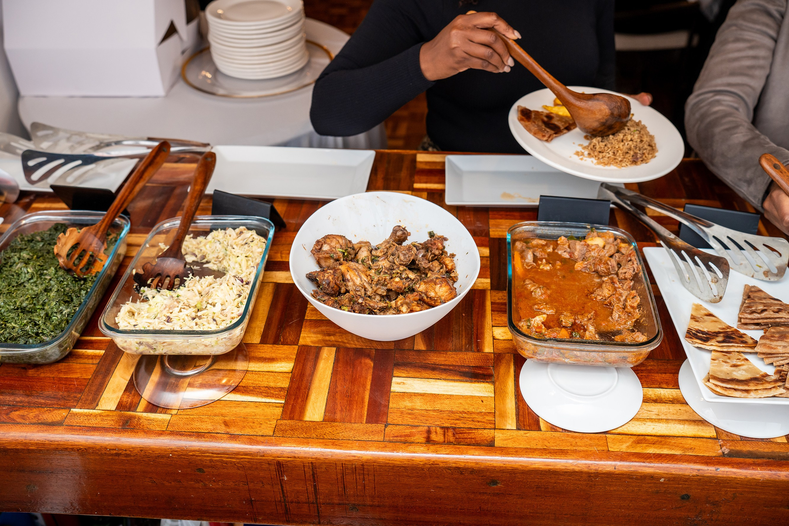 Event buffet setup with assorted dishes at a Nairobi celebration