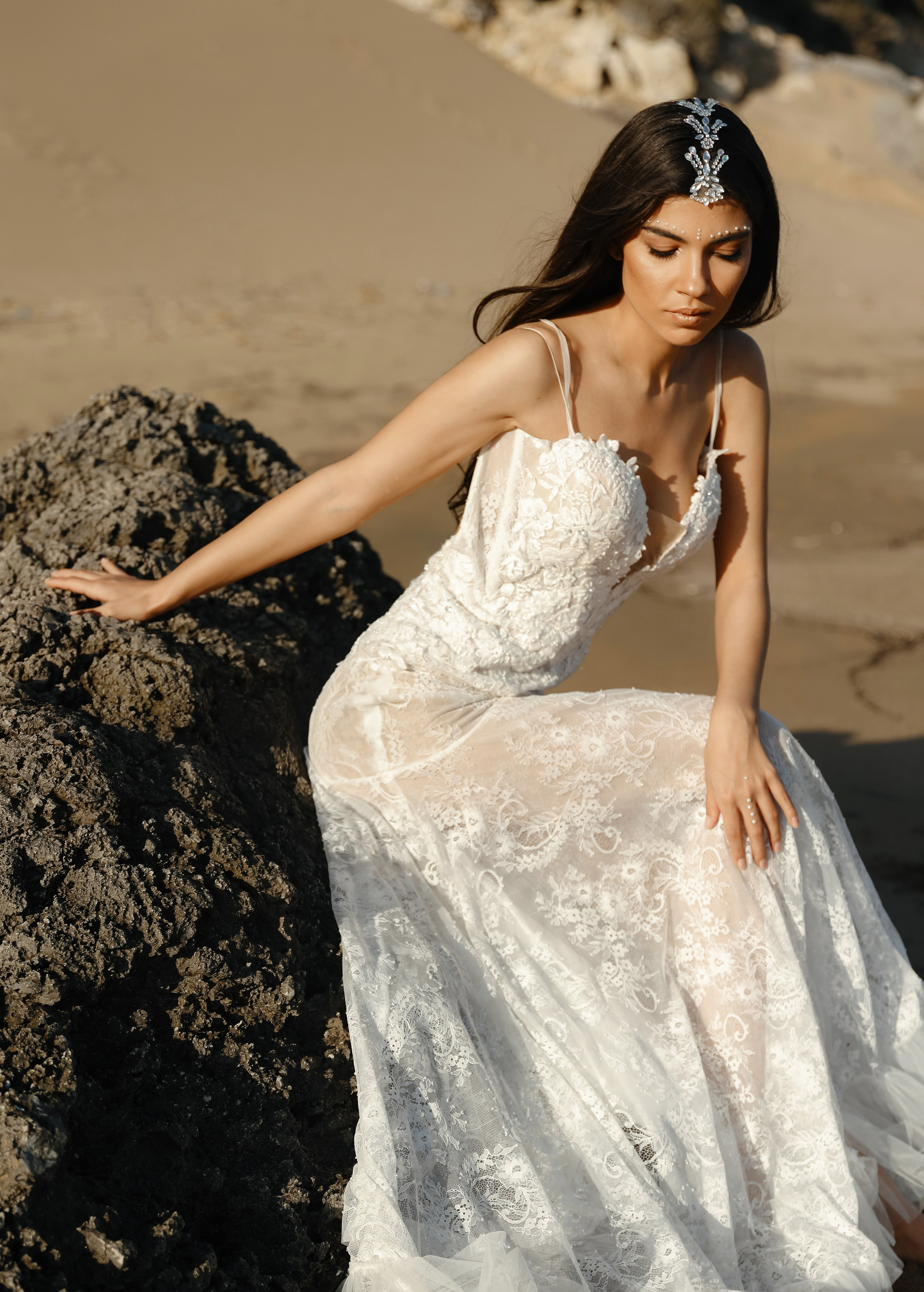 Art photoshoot of a girl in a wedding dress in the desert on a beach Tsampika in Rhodes
