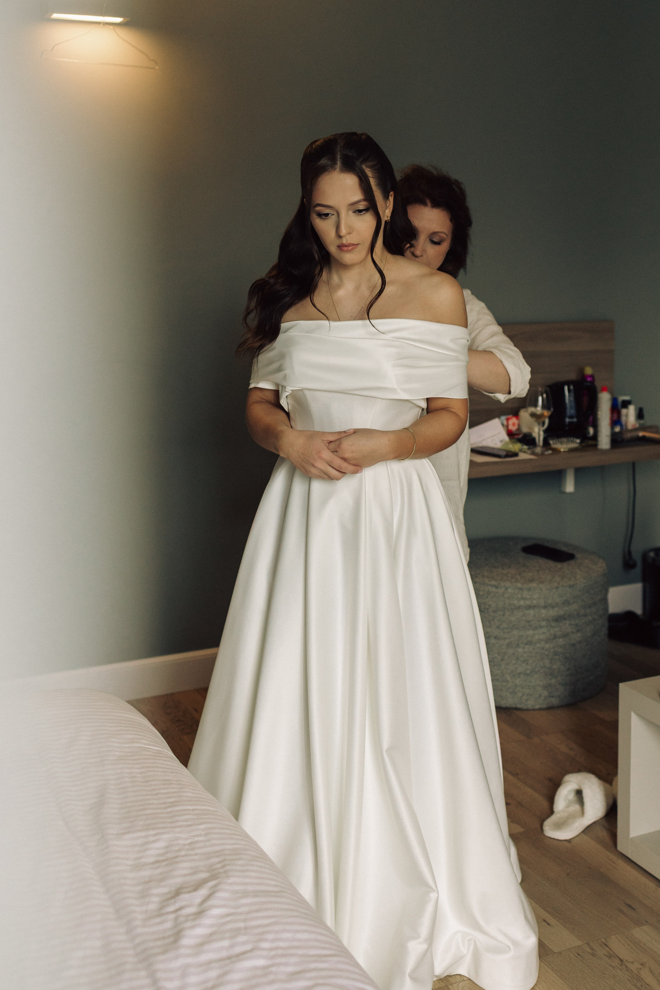 Mother helping the bride get ready for her intimate wedding in Italy